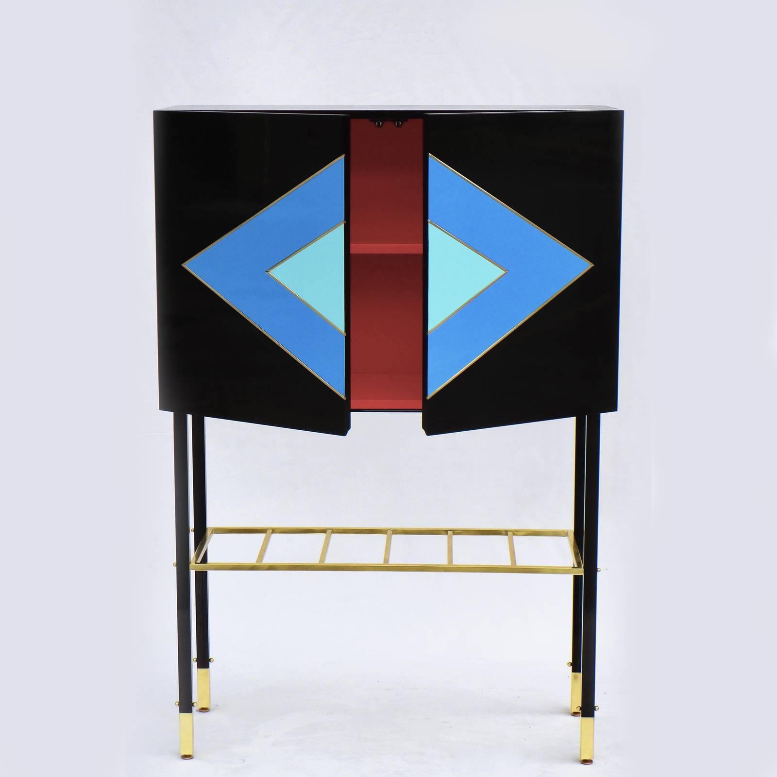 With its striking aesthetic, bold colors and geometric shapes, this modern cabinet blends originality with style in a design that effortlessly matches any decor. Featuring lacquer-finished cerulean and aqua diamond-shape inlays with brass outlines