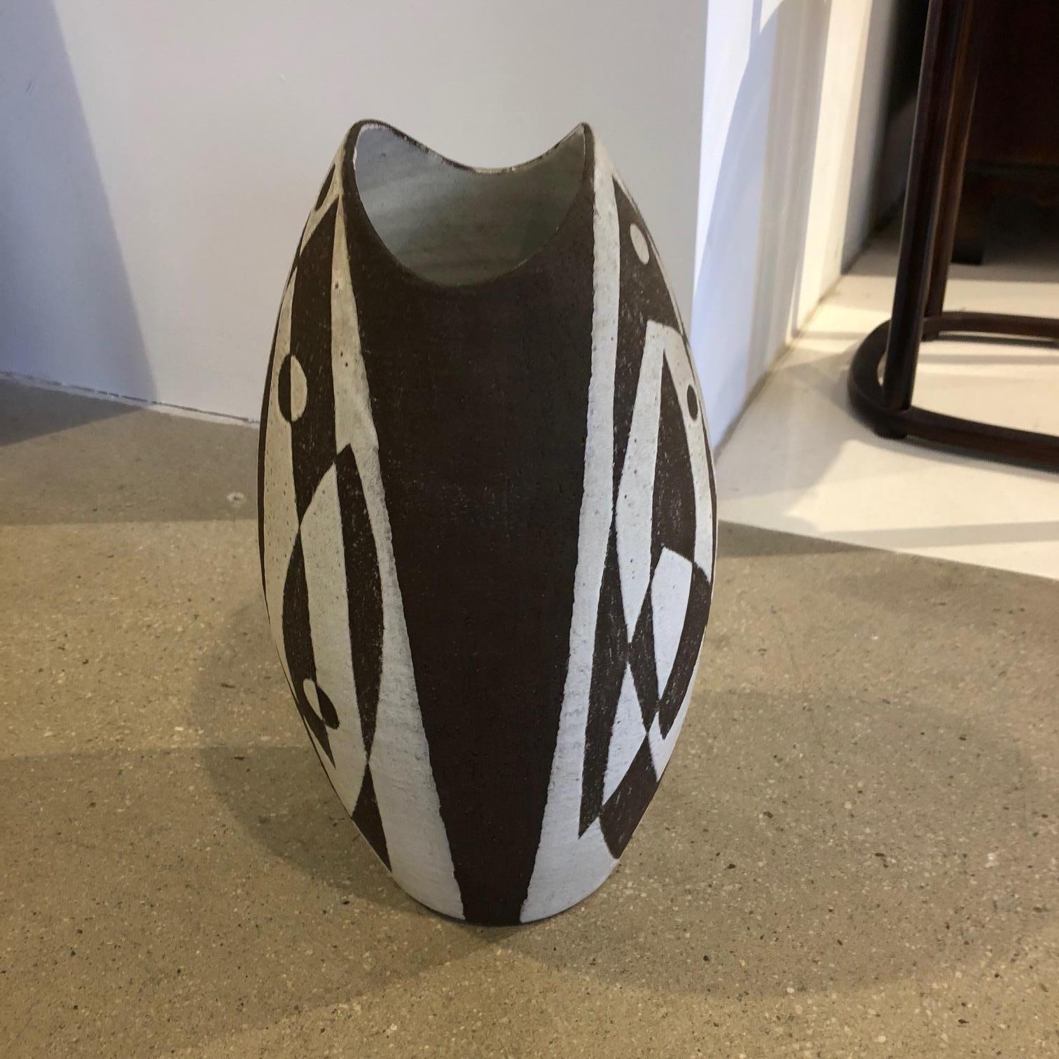 Handmade, graphic, beautifully balanced, substantial black and white vessel signed 