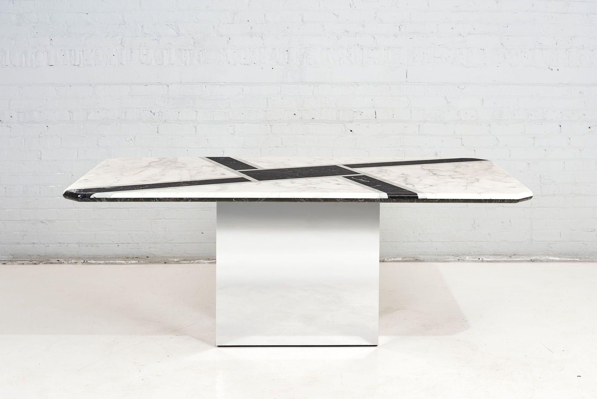Graphic black, white, and grey Marble top dining table with chrome base, circa 1970.

