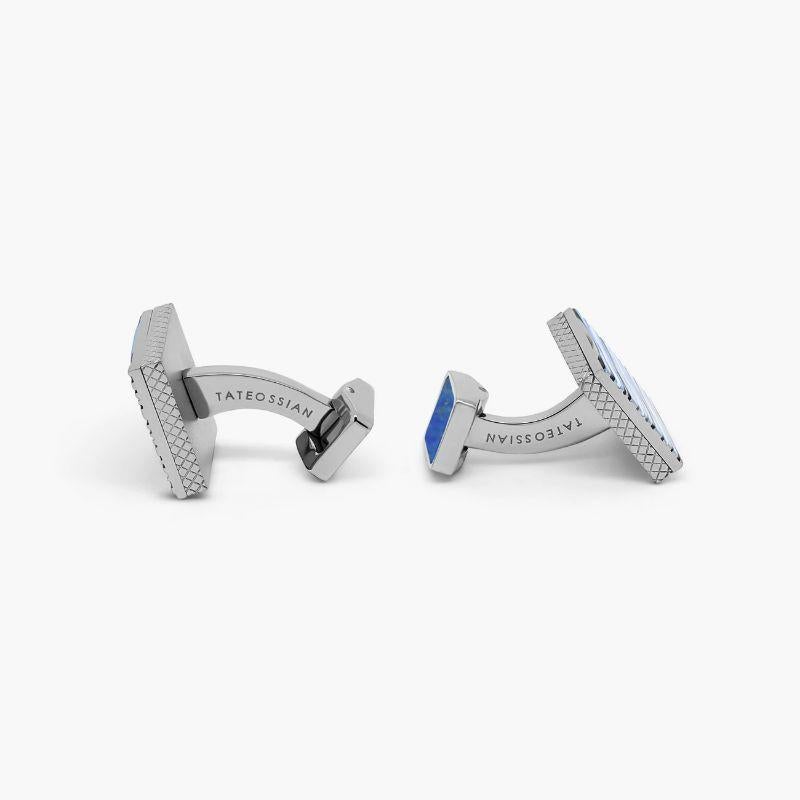 Graphic Onda Cufflinks with Blue Enamel and Sodalite in Titanium

Complex patterns are enhanced with hand-painted blue, black, grey and white-coloured enamel, creating a dynamic blend of tones and textures. The whale tail features a flush inlay of