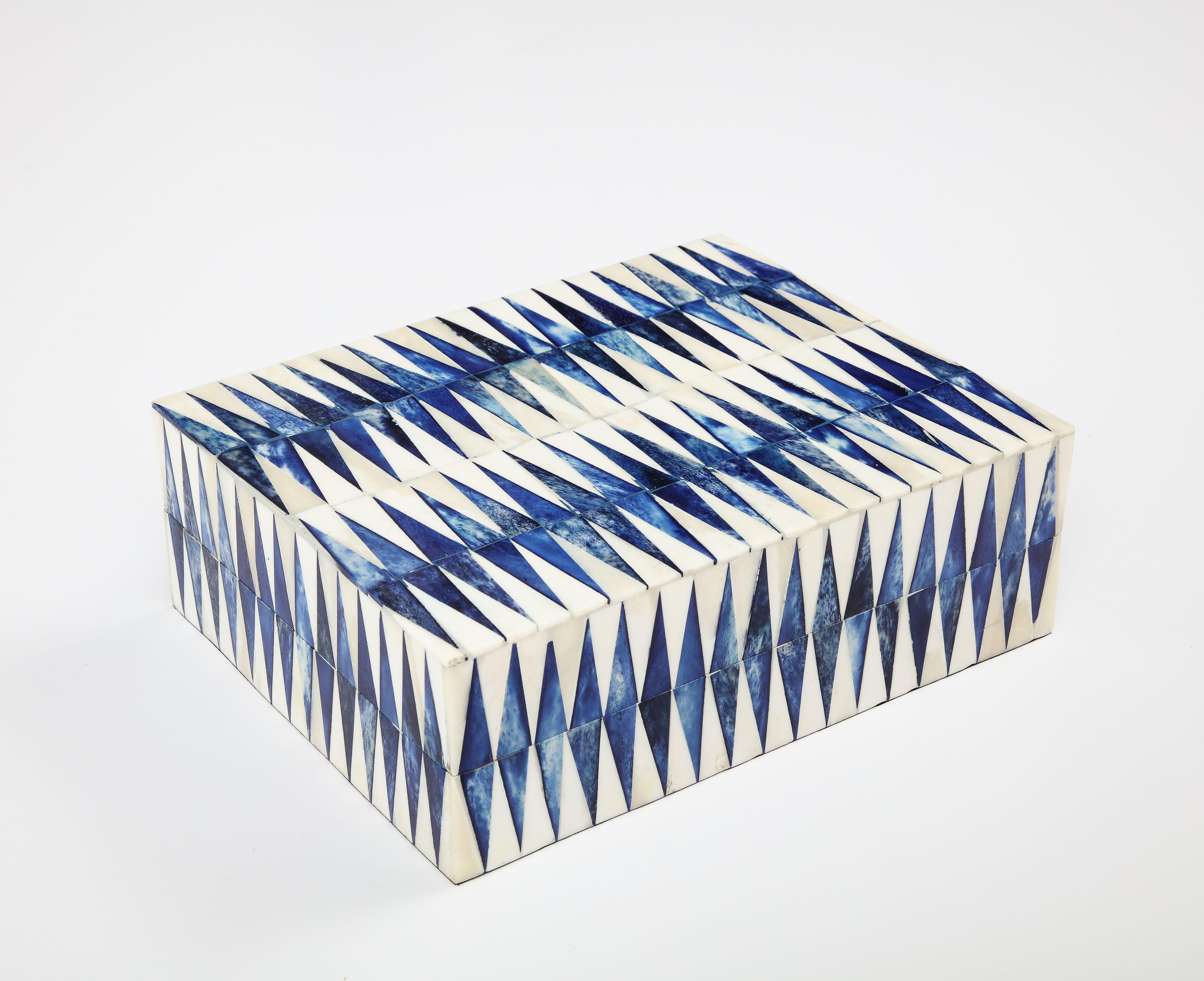 Graphic patterned keepsake box clad in natural and ink blue dyed bone. Tiles are hand set on a wood box.