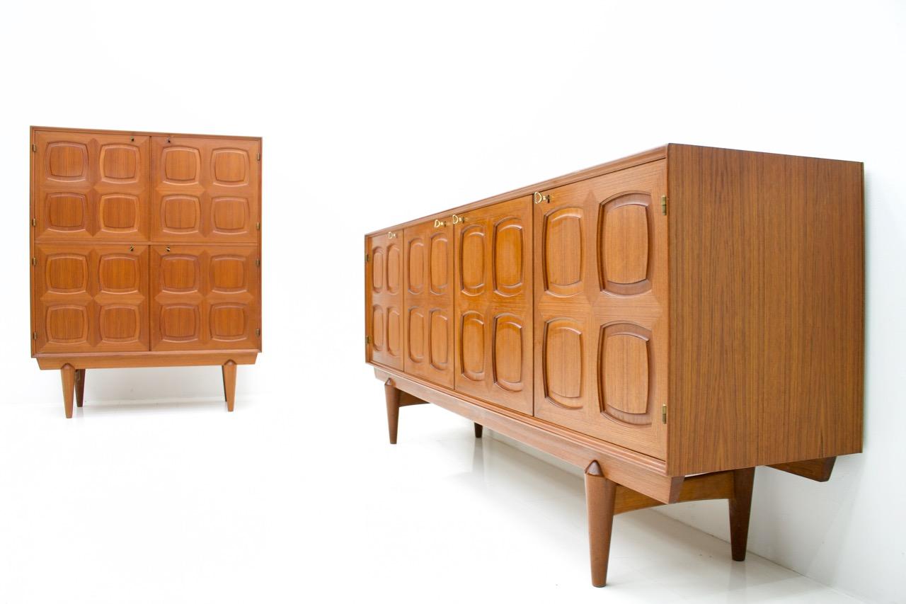 Very nice teak sideboard by Adolf Rastad and Rolf Relling made by Gustav Bahus from Norway, designed in 1960s.
Massive teak wood doors with graphic front. Behind the right door are four adjustable teak wood drawers. All brass keys are