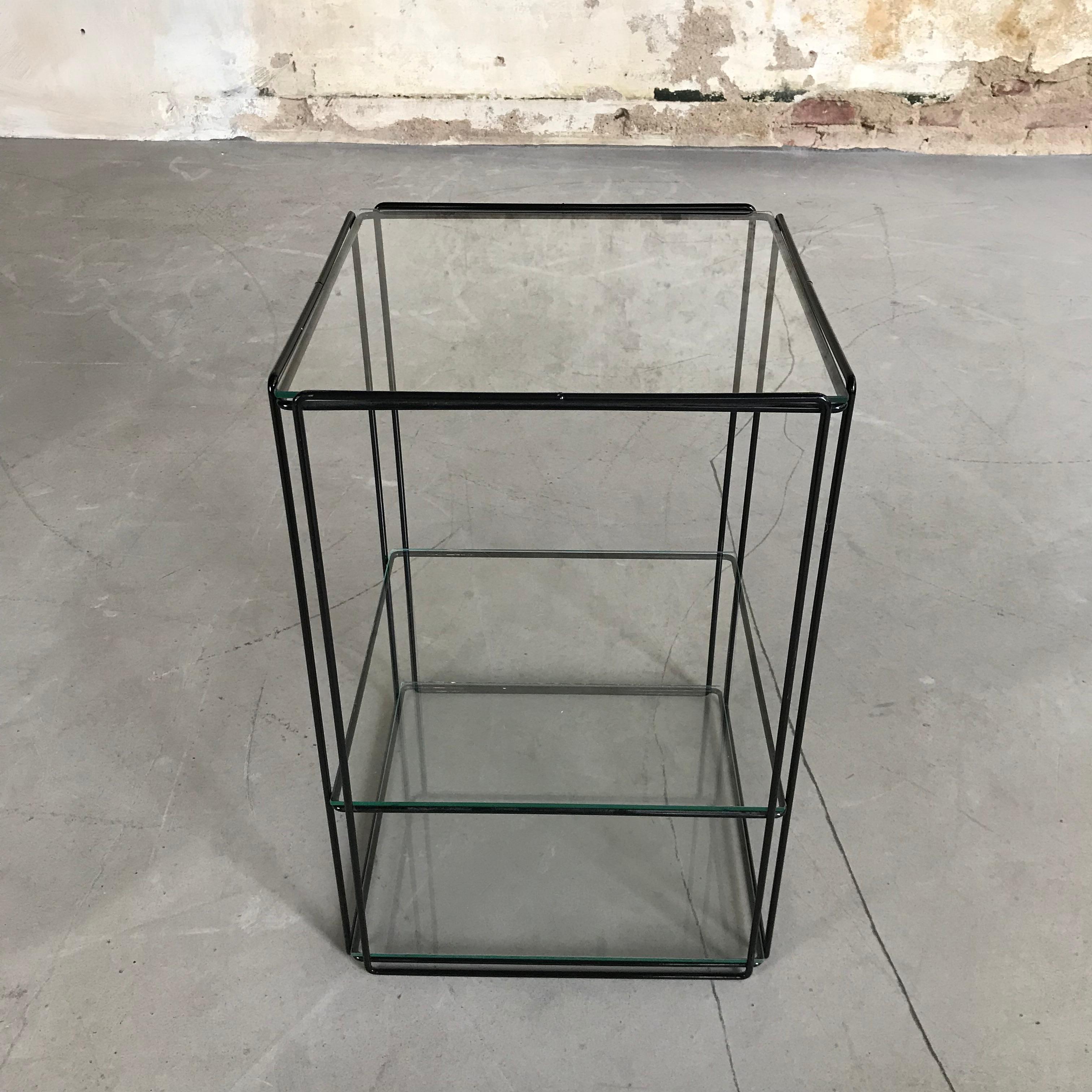 Beautiful, graphical and Minimalist design by Max Sauze for Max Sauze Studio or Atrow, circa 1970. This table features a black colored metal base and three glass 'shelves'. The glass and metal wire structure gives this table a very transparent,