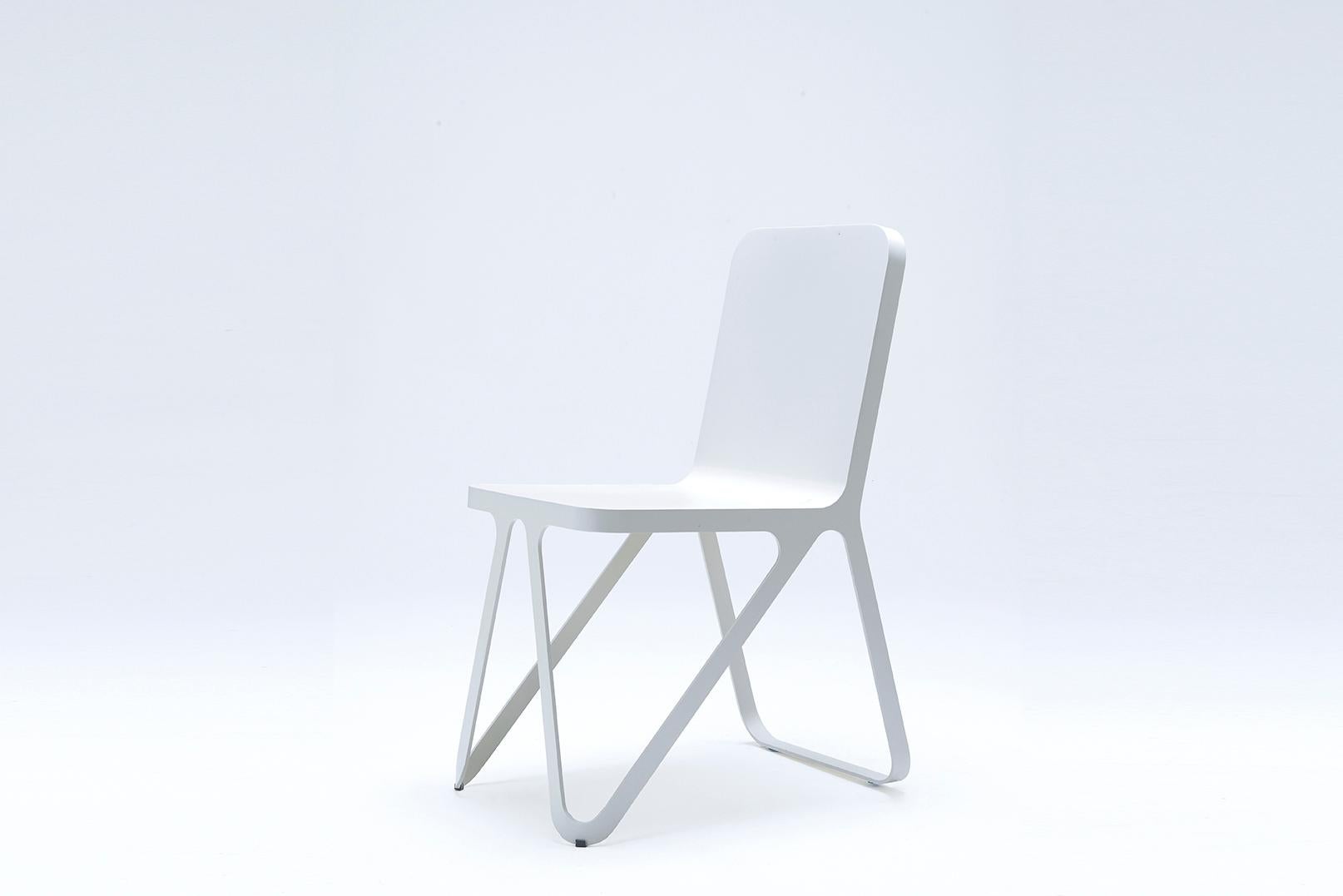 Graphite grey loop chair by Sebastian Scherer
Dimensions: D57x w40 x H80 cm
Material: Aluminium.
Weight: 51 kg.
Also available: Colours: Snow white / light sand / sun yellow / clay orange / rust red / space blue / graphite grey / dark bronze /