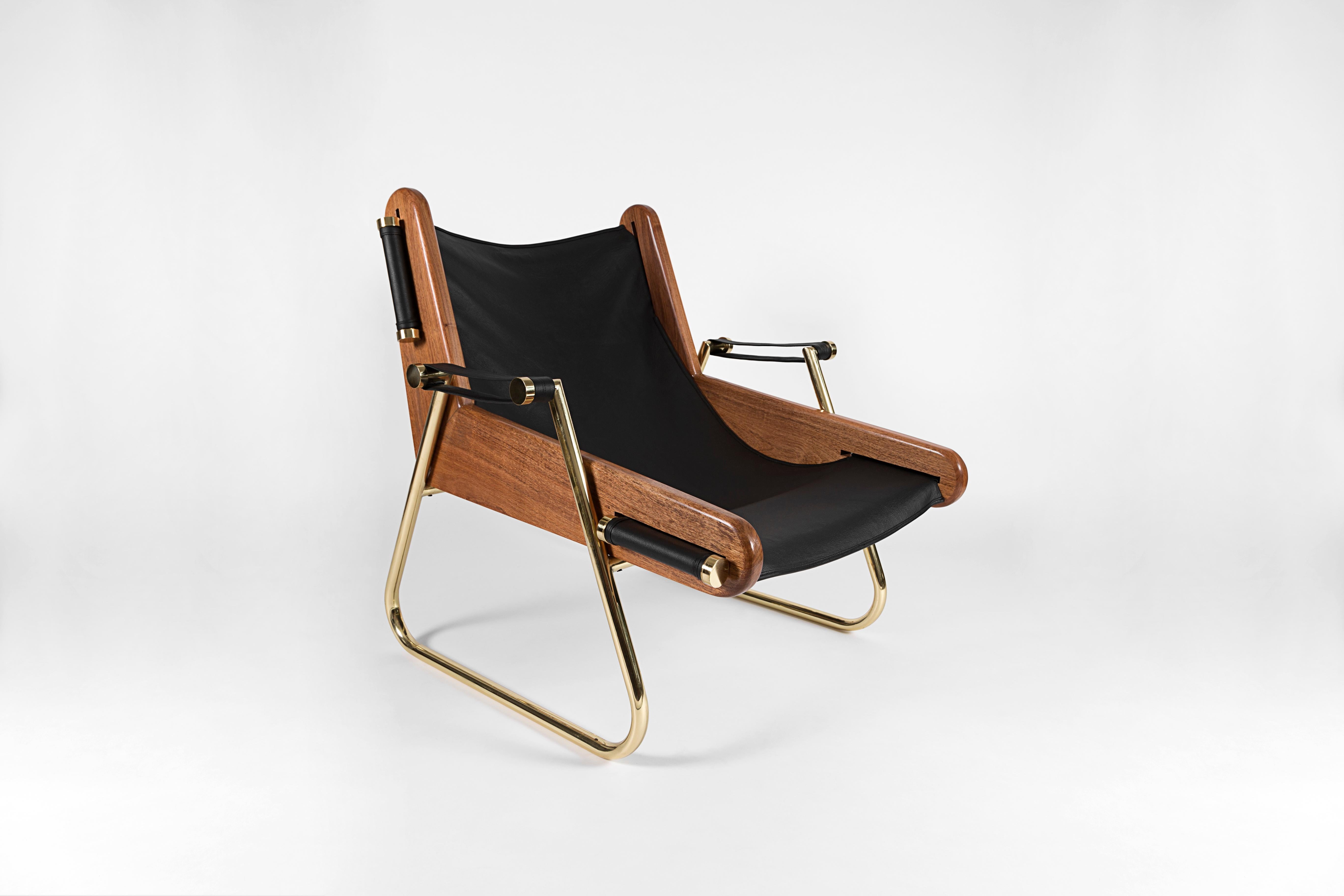 Grappa armchair by Nomade Atelier
Dimensions: D97 x W 77 x H90 cm
Material: Brass, Walnut, Leather.
Available in black leather. For others finishes.

Form meets function in this sleek yet extremely comfortable suspended leather sling chaise. All