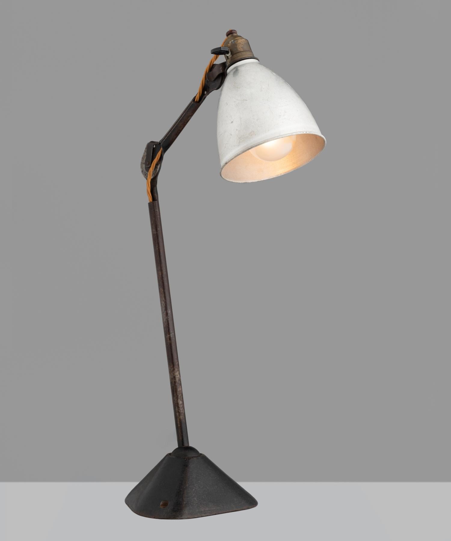 Gras desk lamp, France, circa 1930.

Iconic design by Bernard-Albin Gras features an aluminum shade, cast steel frame with three points of adjustment. Measurement from configuration shown in cover image.

Measures: 7