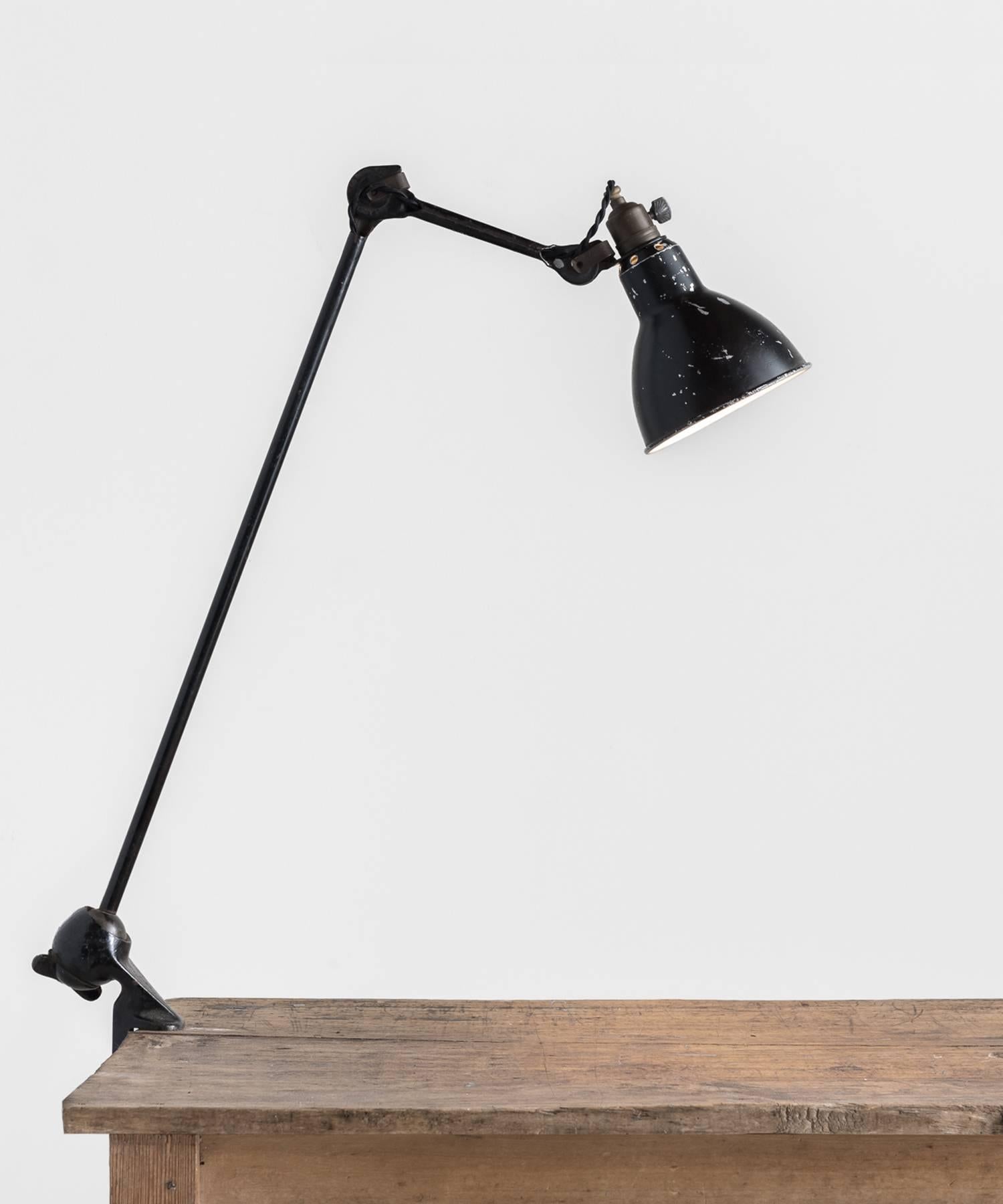 Gras lamp no. 201, circa 1930.

Industrial clamp on desk lamp with three points of adjustment, designed by Bernard-Albin Gras.

Measures: 5.5