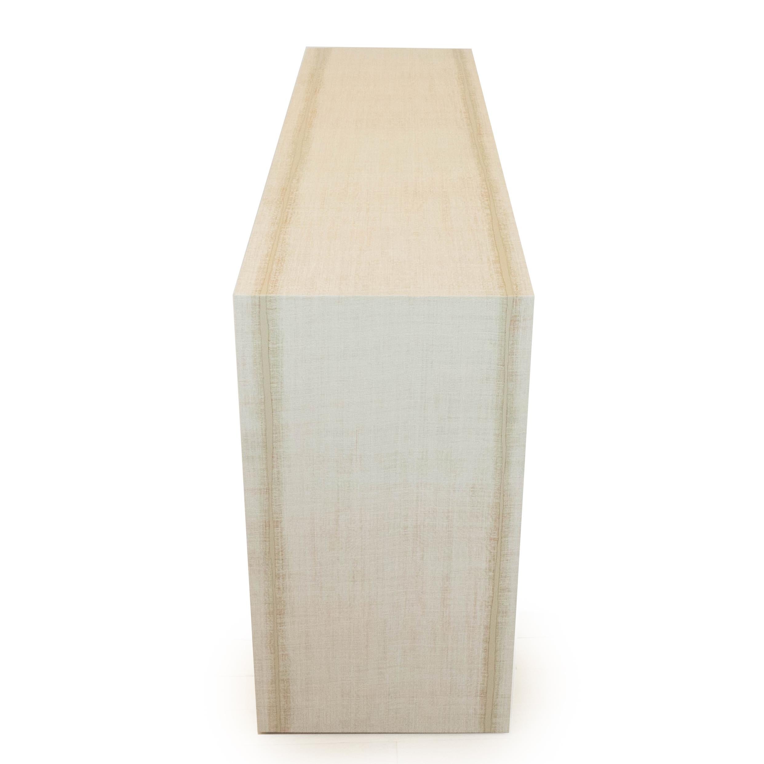 Our Classic Waterfall table has been built out of hardwood and meticulously hand-wrapped in a textured vinyl. Size is customizable. 

Customization may effect price. 

Allow 8 weeks production time. 

Measurements: 60