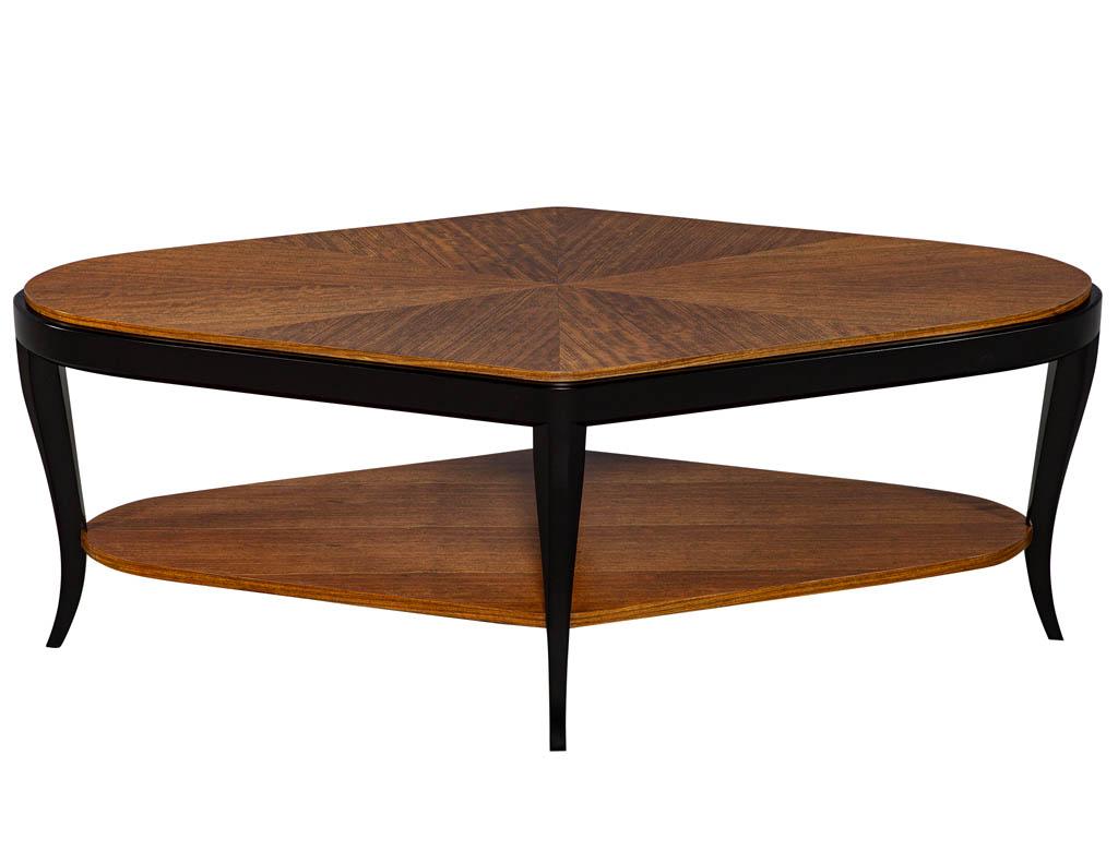 Grasset paragon shaped table with Mozambique tops with a satin black lacquer solid mahogany frame.
Price includes complimentary curb side delivery to the continental, USA.