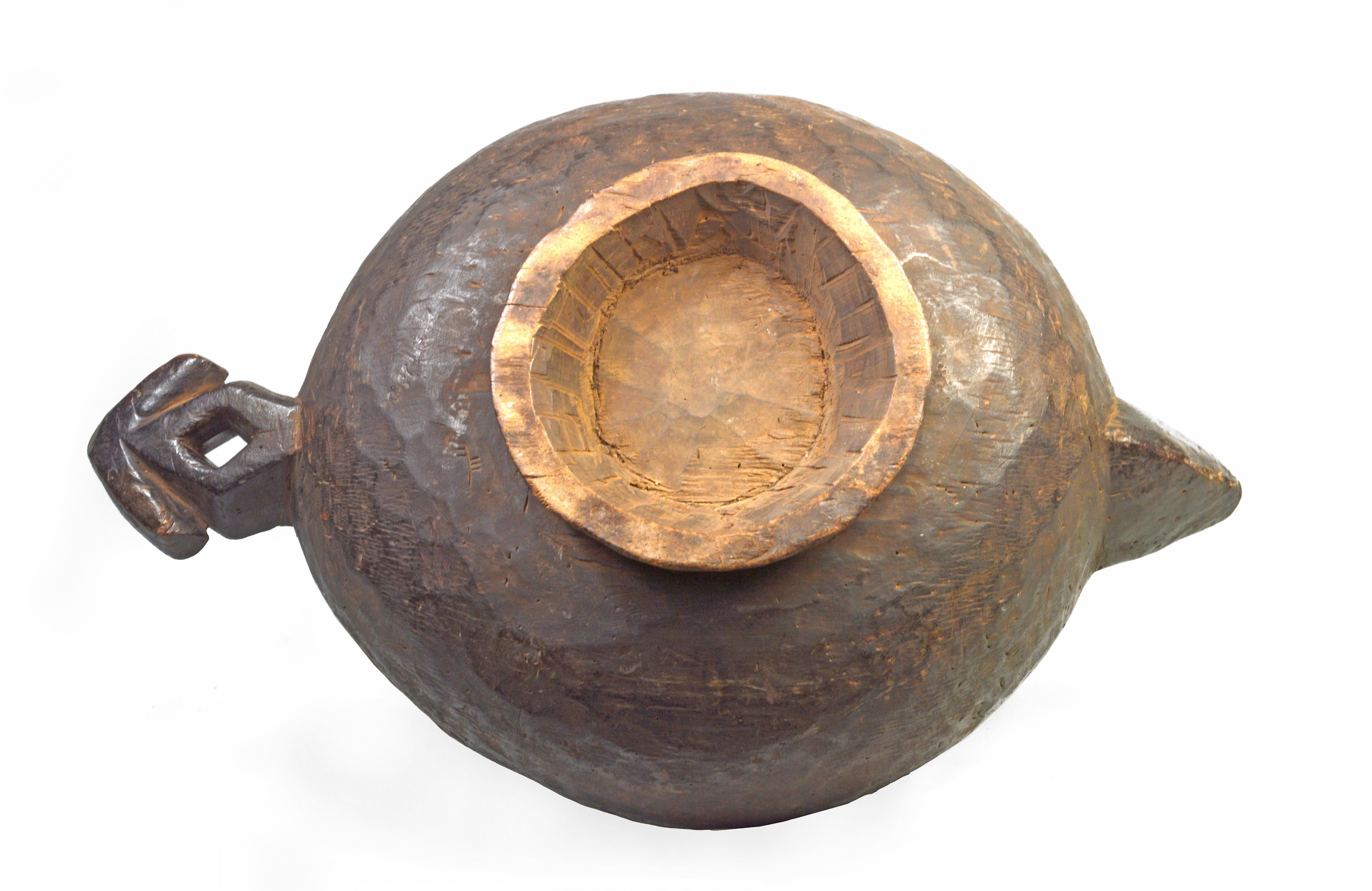 Large, early- to mid-twentieth century serving bowl from the Grassfields region of Cameroon. The Grassfields region of Cameroon sits at an altitude in the country's northwest. The region is inhabited by a number of related ethnic groups, among them