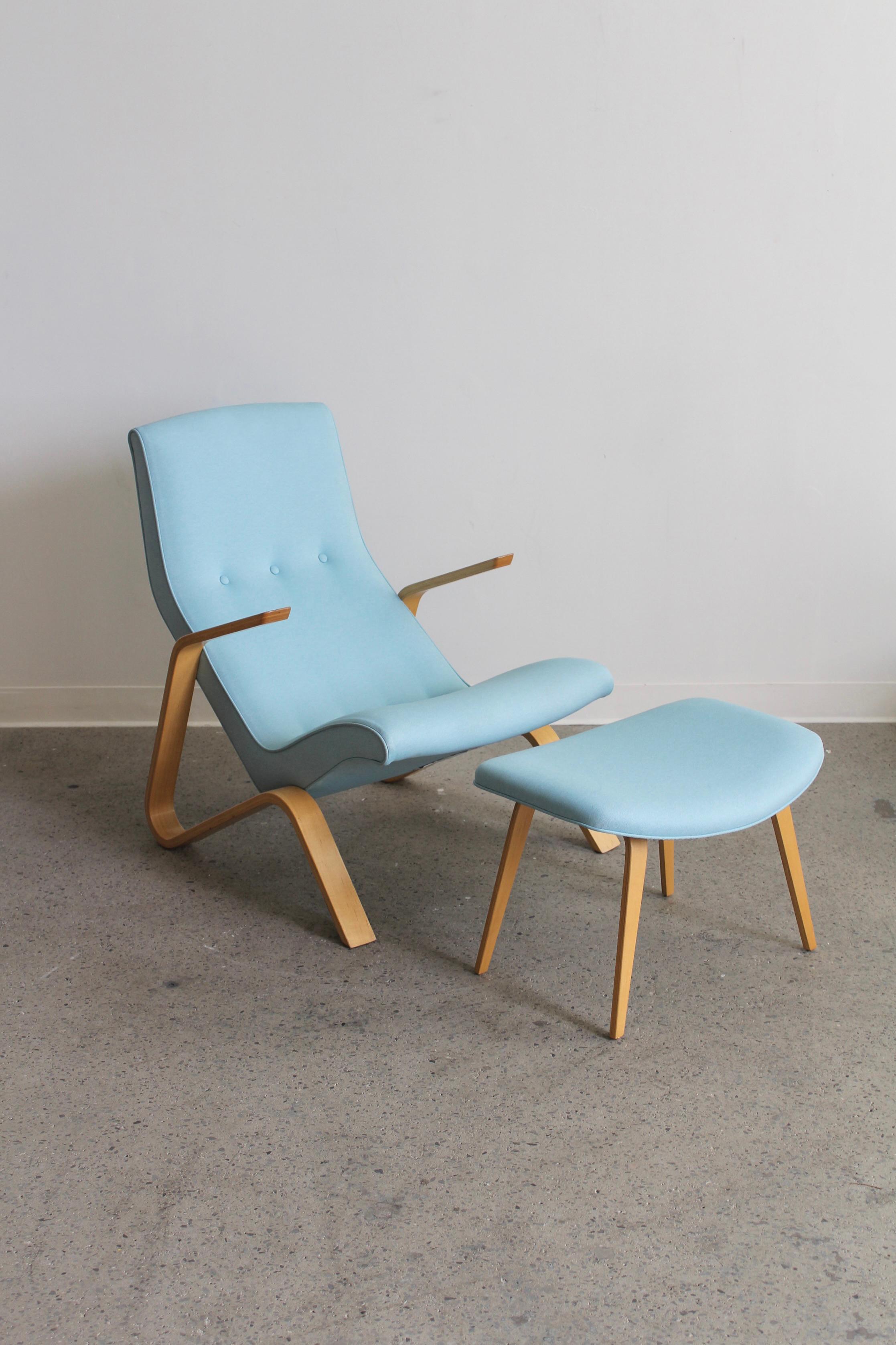 Grasshopper chair and ottoman by Eero Saarinen for Modernica, 2000s. Bentwood arms and legs with a sky blue coloured cotton upholstery.

In great vintage condition, small imperfection on back of chair as per photo.

Dimensions: Lounge Chair: 34