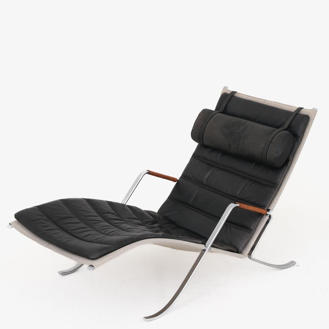 Model FK 87 - 'Grasshopper' chaise lounge in patinated black leather, armrests with leather lace and steel frame. Designed in 1967. Preben Fabricius & Jørgen Kastholm / Lange Production.
 