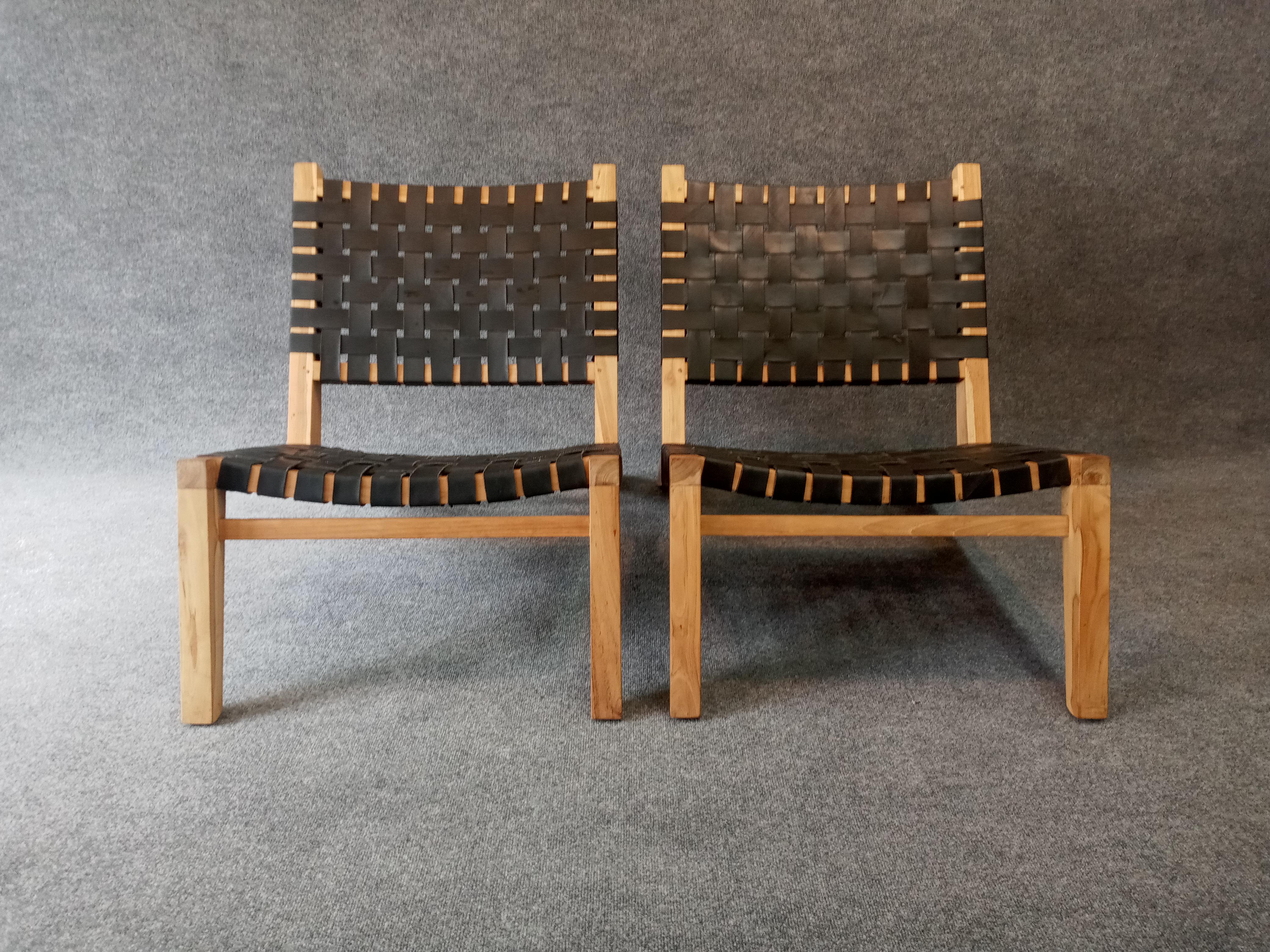 Pair of oiled teak and rubber strapping classic Grasshopper lounge chairs. Made in Brooklyn, these chairs tout a 
