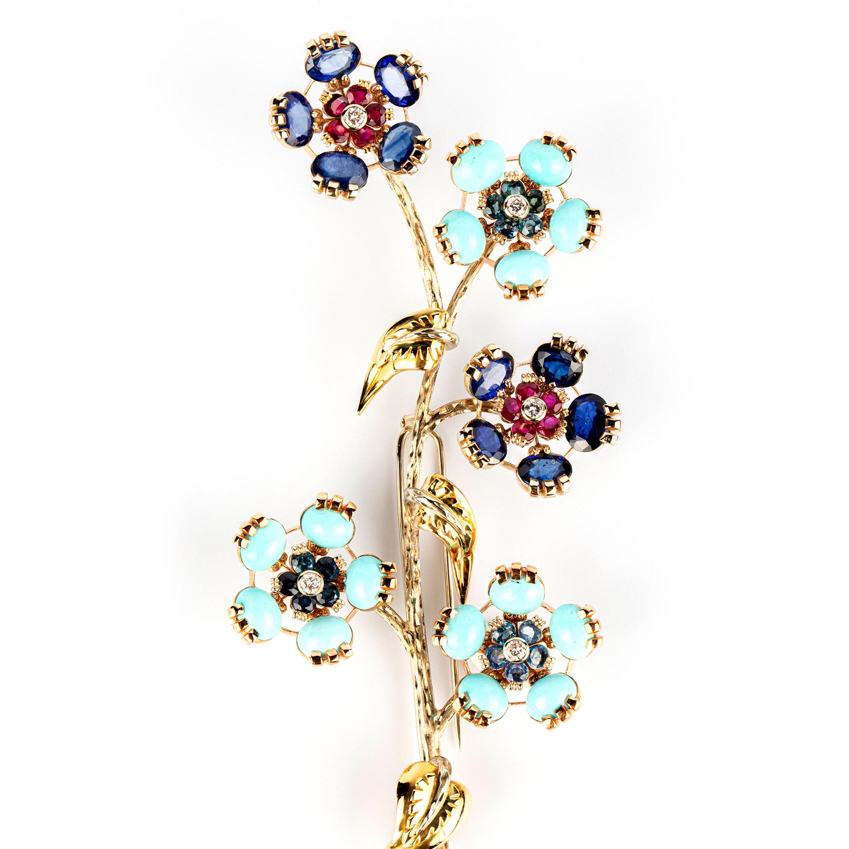 ‘En Tremblant’ brooch in yellow gold with rubies, sapphires, and turquoise by Grassi. Made in Italy, circa 1960.