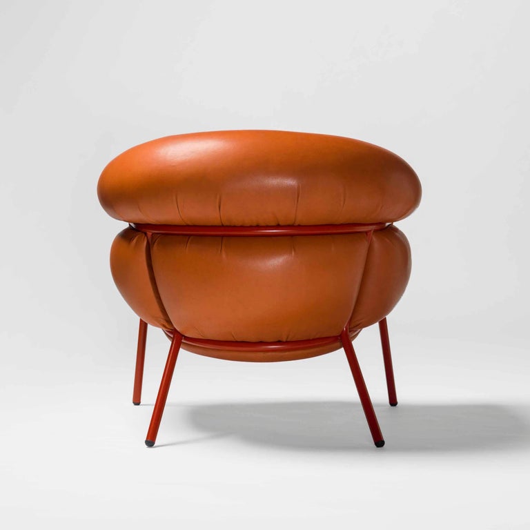 Armchair designed by Stephen Bruks manufactured by BD Barcelona.

An iron tubular (25mm) structured armchair. Seat and backrest upholstered in leather.

We have the possibility in different colors.

The leather upholstery oozes over the bare