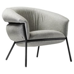 Grasso Armchair by Stephen Burks padded grey curved upholstery black structure