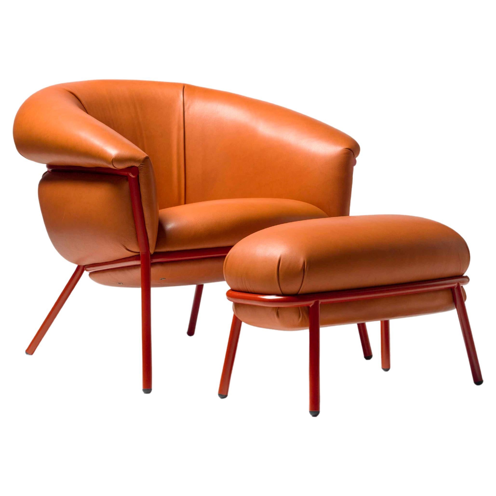 Grasso armchair + footstool by Stephen Burks organge leather red metal structure