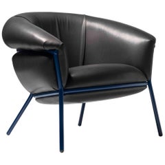 Ultra comfort armchair upholstered in leather and metal frame by Stephen Burks