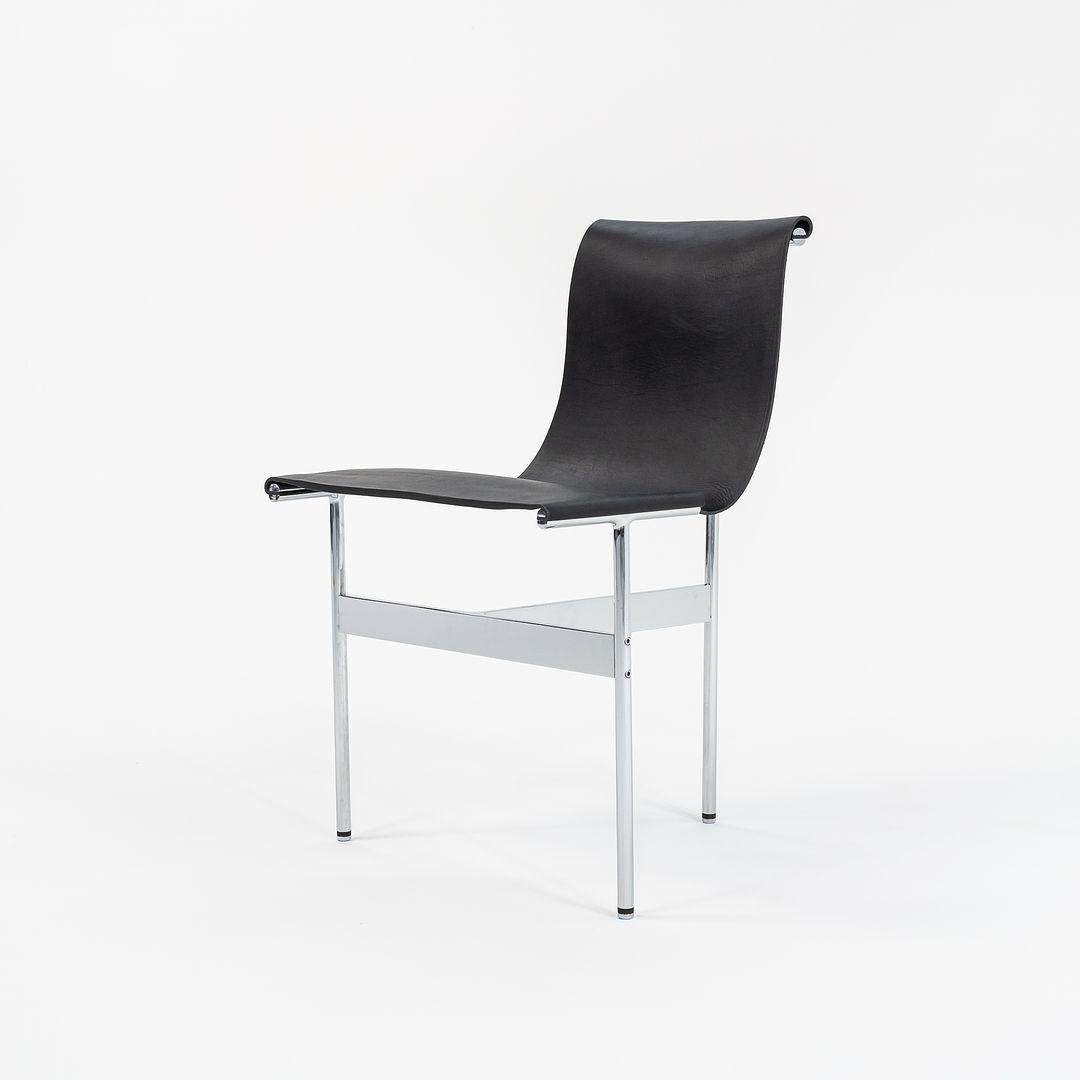This is a TG-10 sling dining chair in black leather with a polished chrome frame, produced by Gratz Industries. The chair was designed by Katavolos, Littell and Kelley in 1952 as part of the original Laverne Collection produced by Gratz Industries,