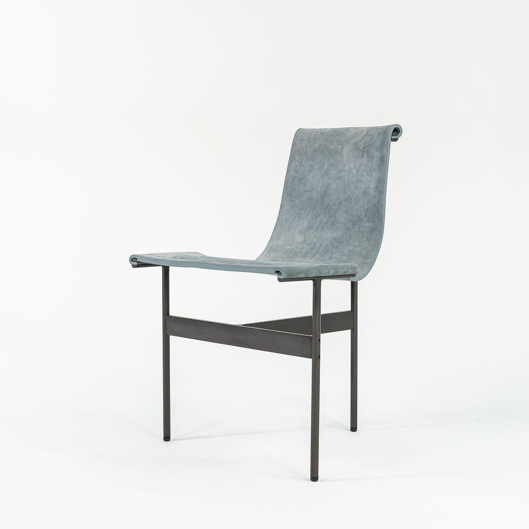 This is a TG-10 sling dining chair in blue suede with a blackened frame, produced by Gratz Industries. The chair was designed by Katavolos, Littell and Kelley in 1952 as part of the original Laverne Collection produced by Gratz Industries, formerly