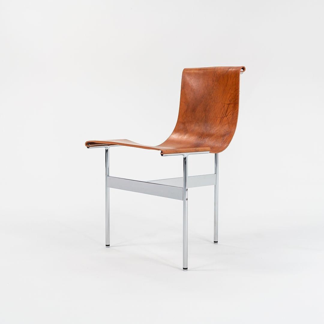 This is a TG-10 sling dining chair in tan leather with a polished chrome frame, produced by Gratz Industries. The chair was designed by Katavolos, Littell and Kelley in 1952 as part of the original Laverne Collection produced by Gratz Industries,