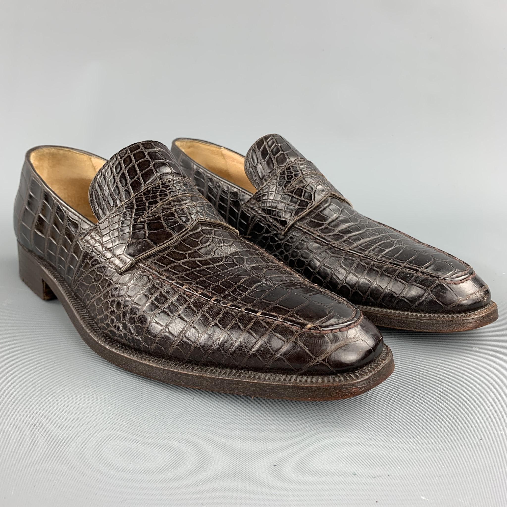 GRAVATI per WILSON AND DEAN for WILKES BASHFORD loafers comes in a brown textured crocodile featuring a penny strap and a wooden sole. Made in Italy.

Excellent Pre-Owned Condition.
Marked: 8.5 M 

Outsole:

11.5 in. x 4 in. 

