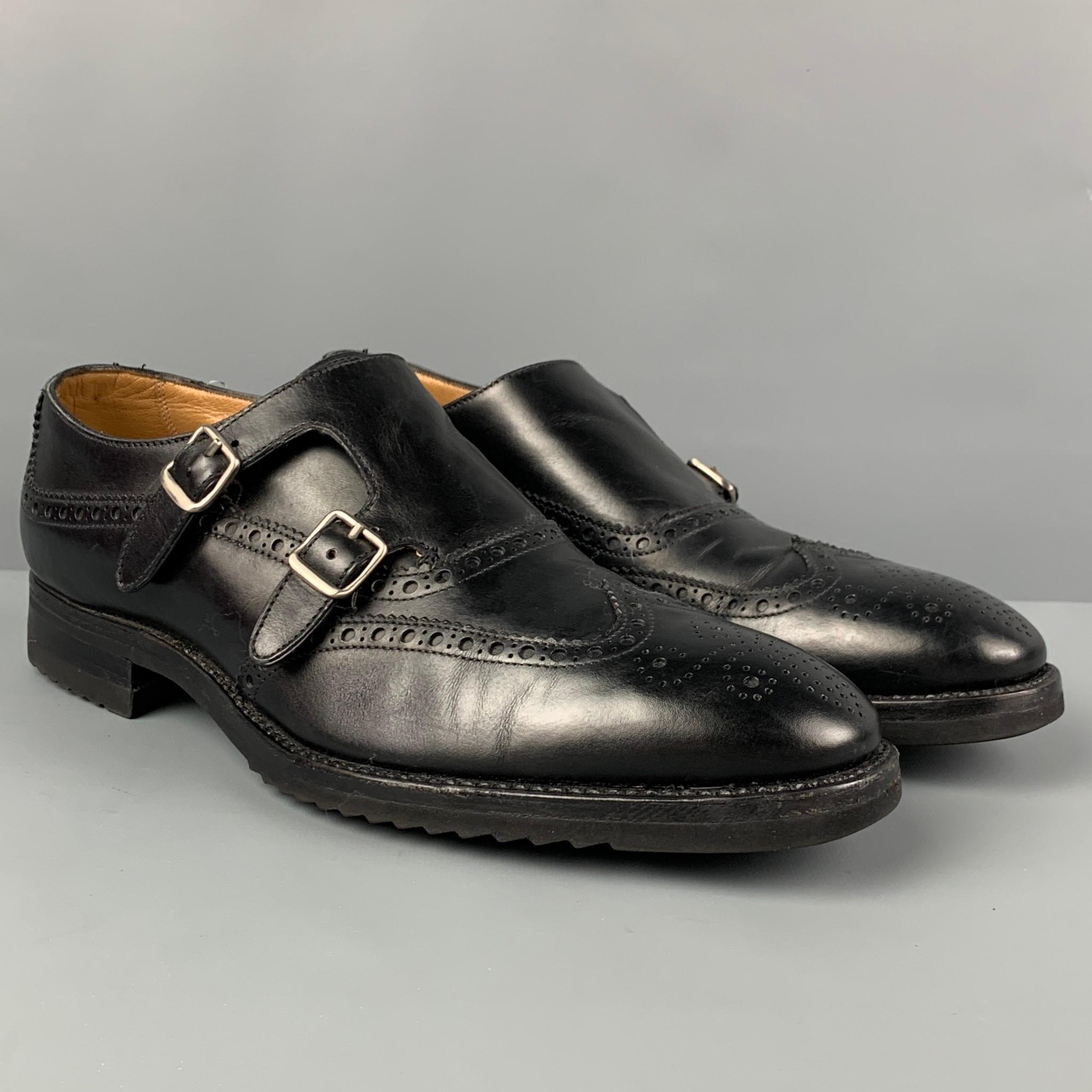 GRAVATI shoes comes in a black perforated leather featuring a double monk strap and a rubber sole. Made in Italy. 

Very Good Pre-Owned Condition.
Marked: 19199 10 M  787

Outsole: 12 in. x 4.25 in. 