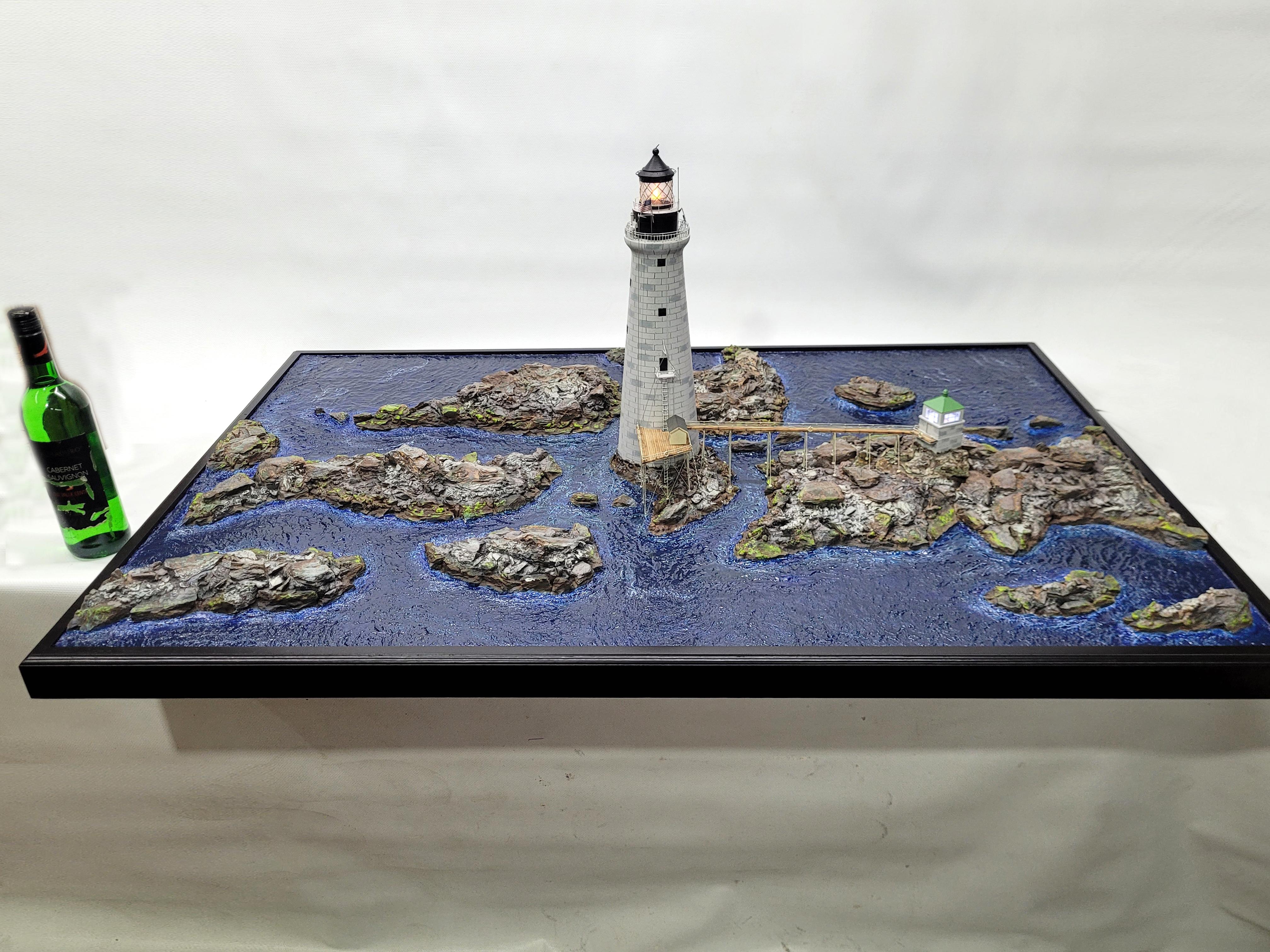 Remarkable diorama showing graves light in Boston Harbor. This is expertly crafted with proper scale. The granite stone tower is expertly crafted with a turned wood cylinder incised with the same amount of blocks, then distressed. The lantern room