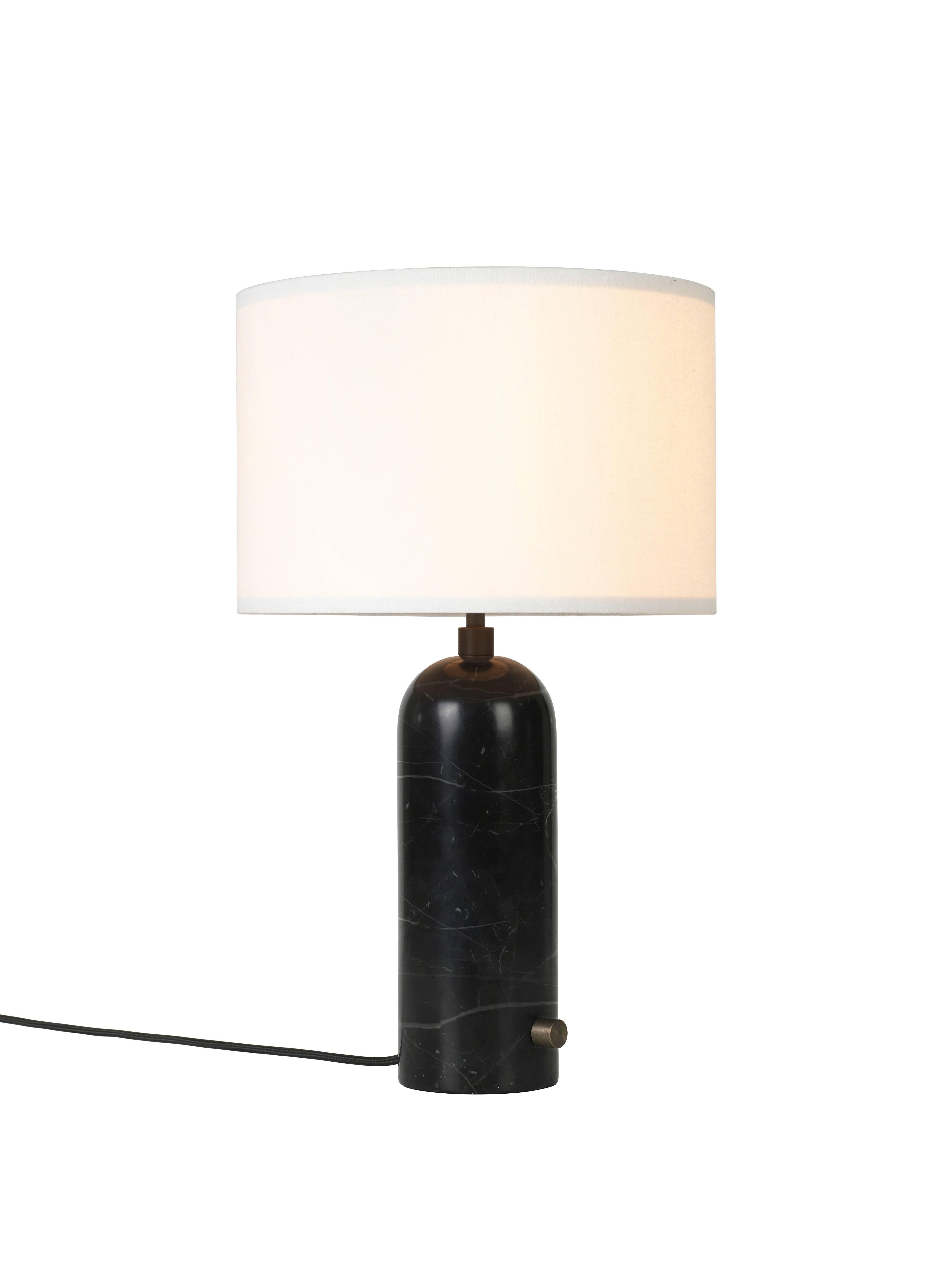'Gravity' black marble table lamp 
Dimensions: 65 x 41 x 41 cm
Material: Marble
Designer: Louis Weisdorf
Produced by Gubi in Denmark

The new Gravity Collection designed by Space
Copenhagen, consisting of a table lamp and a floor
lamp, is
