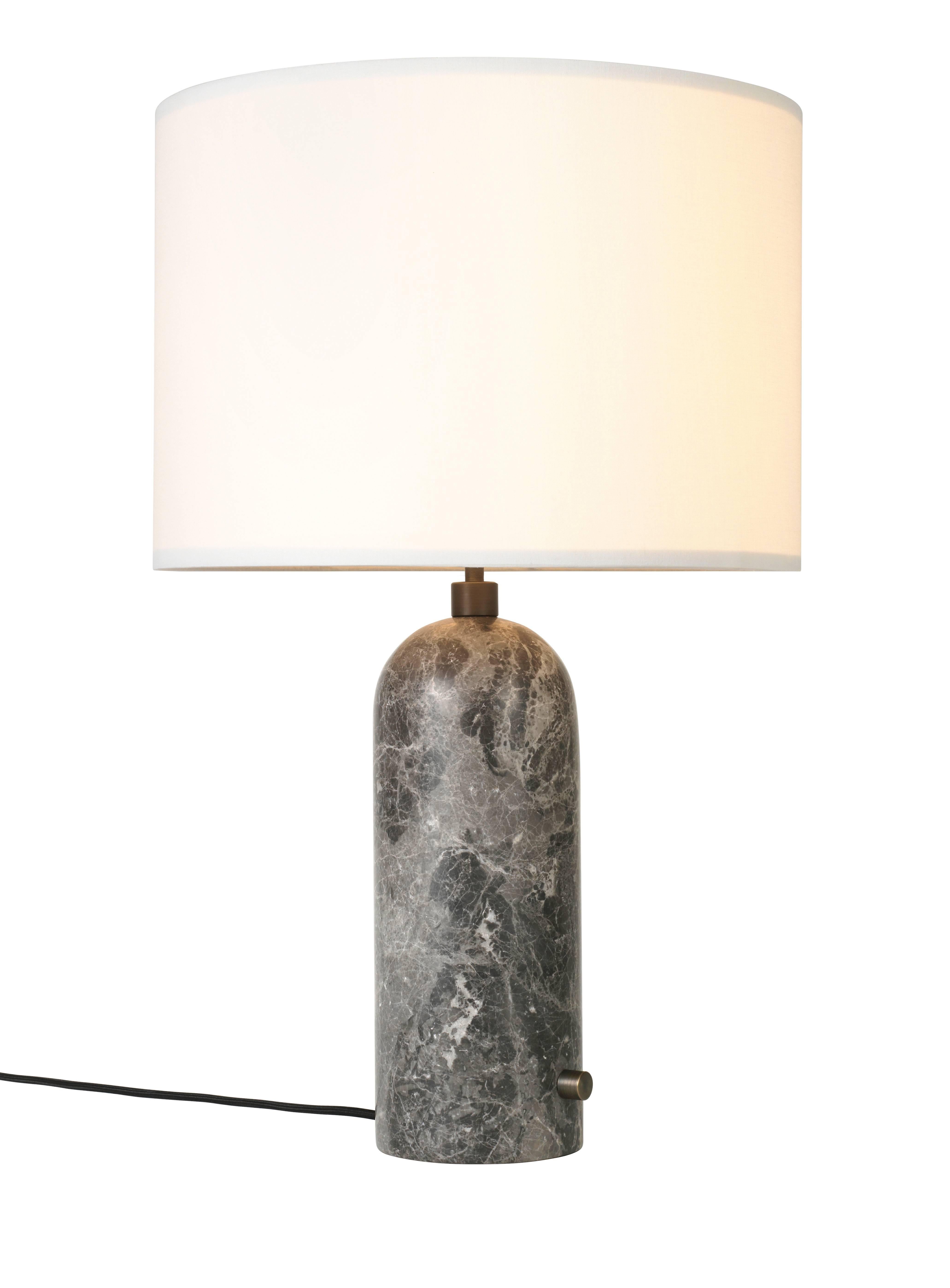 Gravity, grey marble table lamp
Dimensions: 65 x 41 x 41 cm
Material: Marble
Designer: Louis Weisdorf
Produced by Gubi in Denmark

The new Gravity collection designed by Space
Copenhagen, consisting of a table lamp and a floor
lamp, is