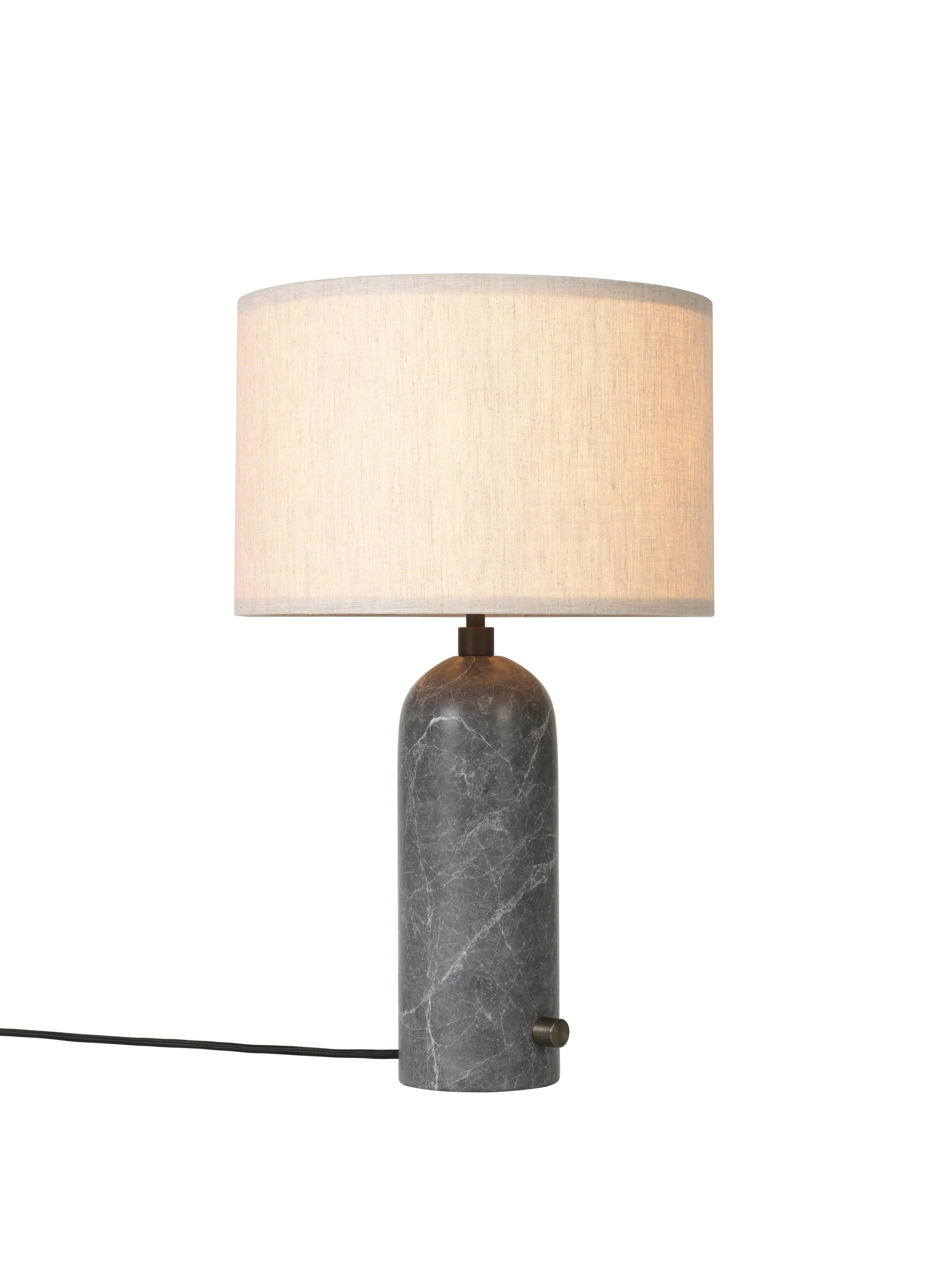 'Gravity' grey marble table lamp 
Dimensions: 65 x 41 x 41 cm
Material: Marble
Designer: Louis Weisdorf
Produced by Gubi in Denmark

The new Gravity Collection designed by Space
Copenhagen, consisting of a table lamp and a floor
lamp, is