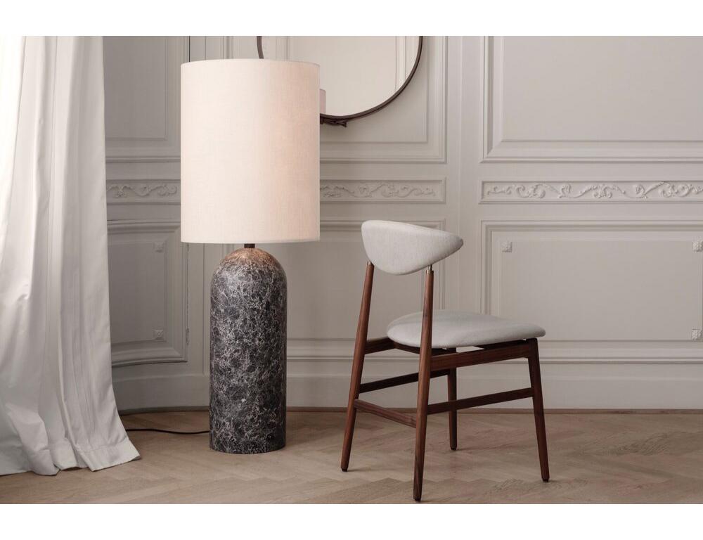 'Gravity XL High' floor lamp for Gubi in gray marble with canvas shade.

Executed in solid marble, with a black cloth cord and dimmer, the Gravity XL Floor Lamp designed by Space Copenhagen for GUBI contrasts strength and fragility. The lamp has a