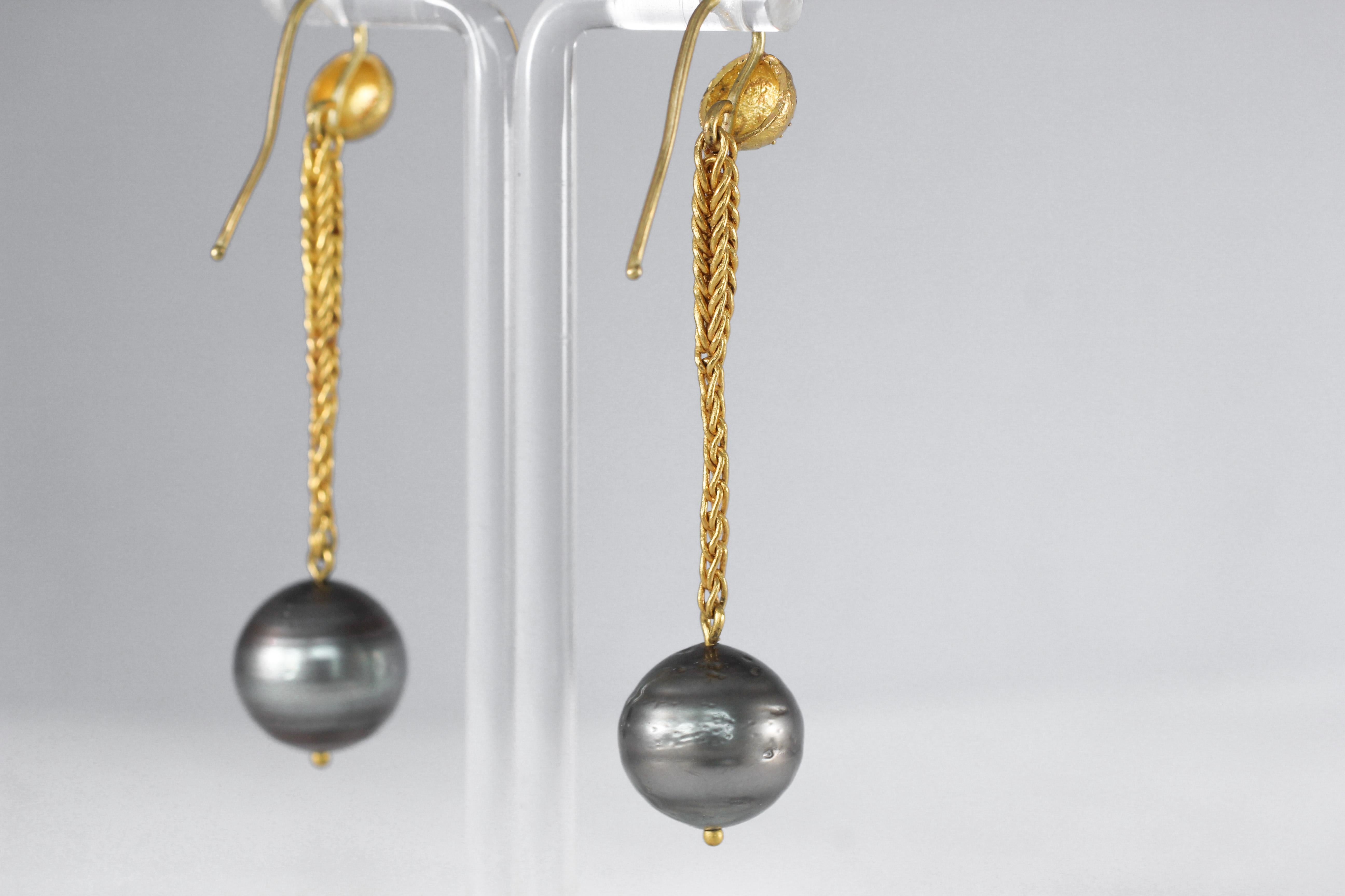 Midnight Pearls Earrings. Simple, elegant dangle drop earrings. A Handwoven chain descends from a hand-engraved hemisphere. The chain terminates with ridged black/green cultured pearl measuring 14-15mm.  A classic antique twist on a minimal modern