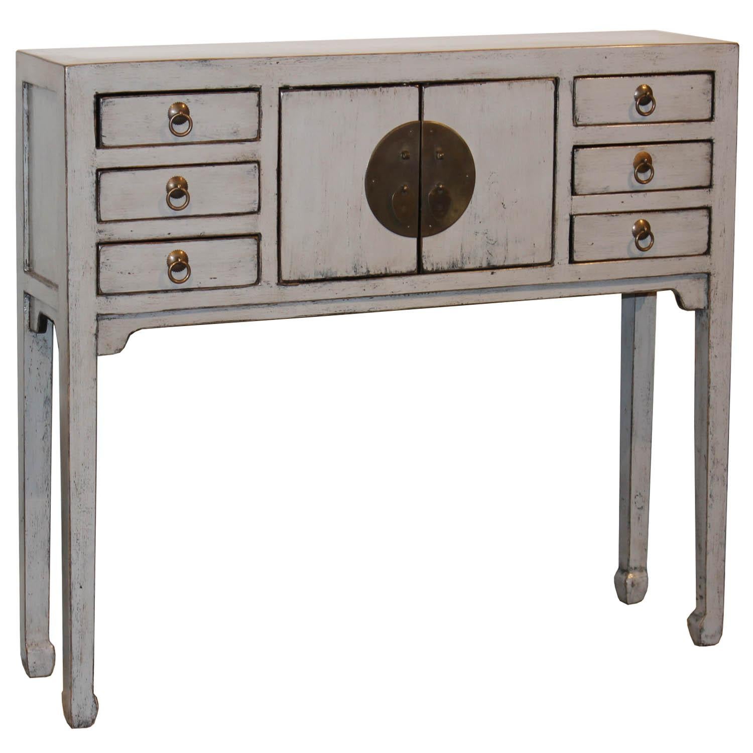 Contemporary gray lacquer console table with two doors, six small drawers and horse hoof-style legs. Perfect as an entry way piece or at the end of a hallway.