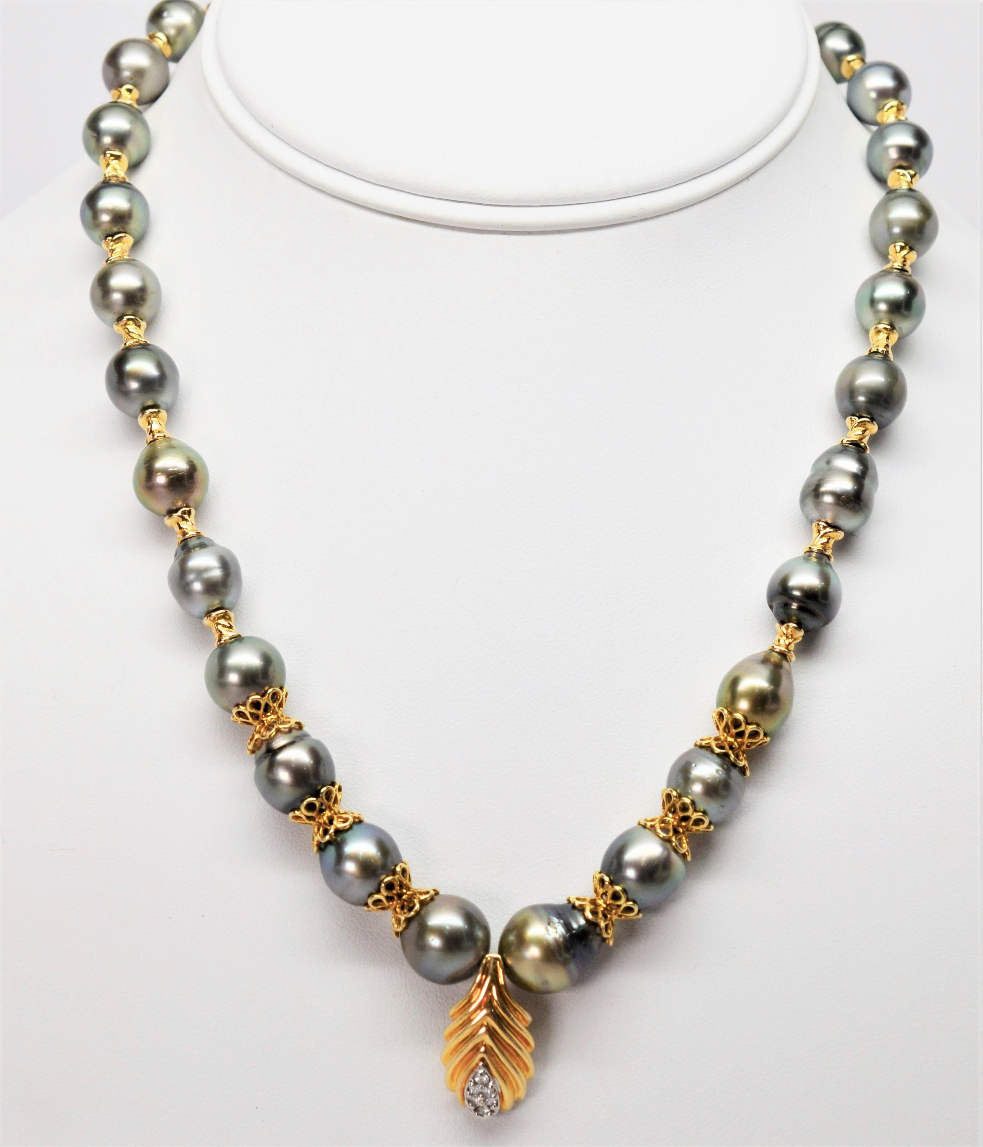 Lustrous silvery gray baroque and ringed Akoya Pearls graduating from 8 mm to 11 mm create this sophisticated strand. Uniquely hand strung with fancy fourteen carat yellow gold filigree accents leading to a polished yellow gold pendant with diamond