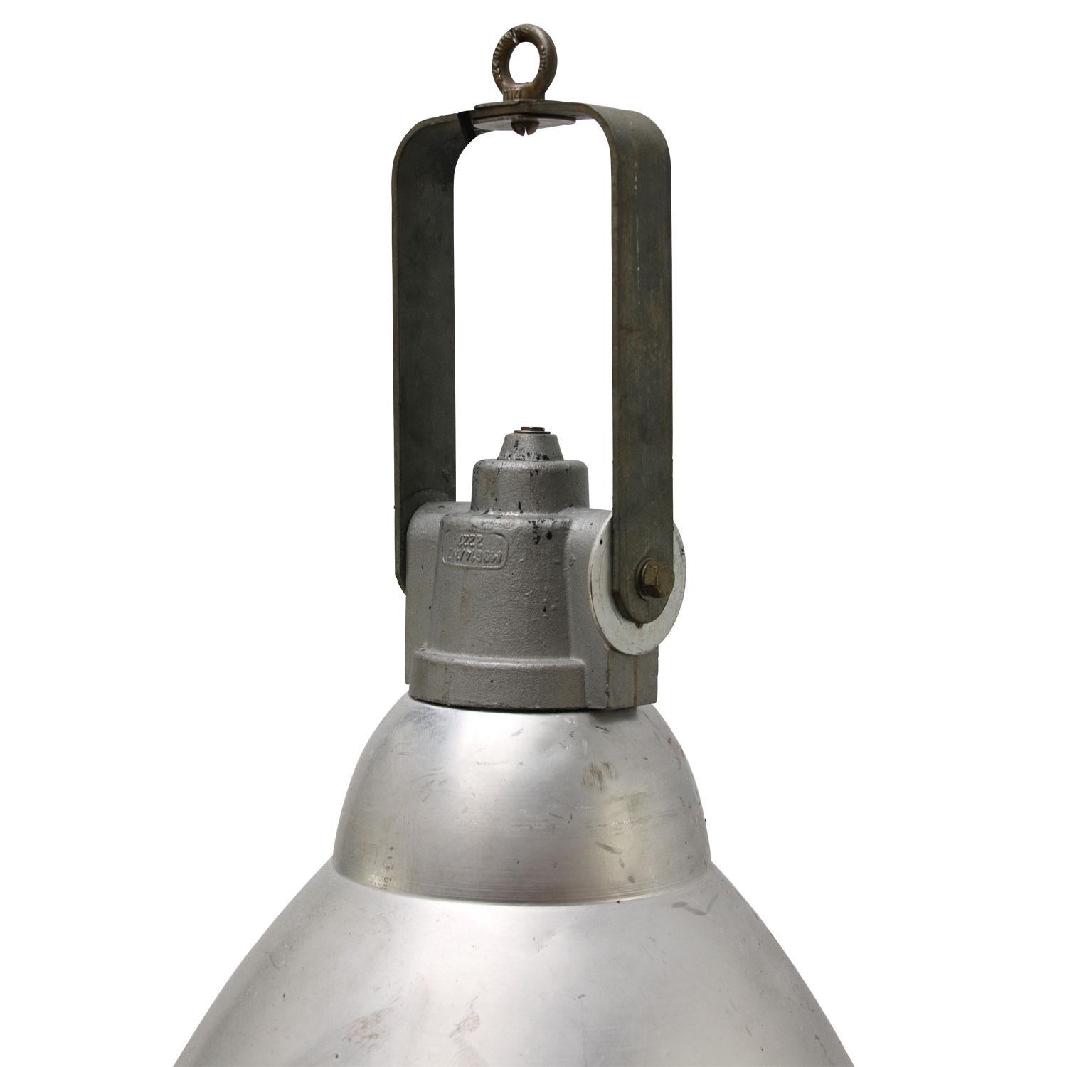 Industrial hanging pendant lamp.
Aluminum shade, cast iron top, clear glass.

Weight: 7.80 kg / 17.2 lb

Priced per individual item. All lamps have been made suitable by international standards for incandescent light bulbs, energy-efficient and