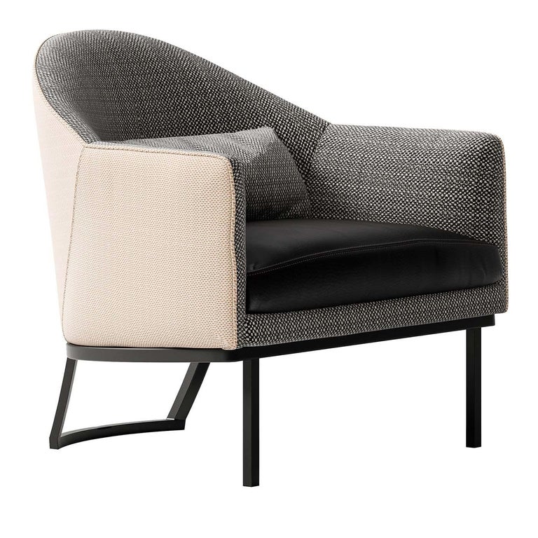 This armchair revisits the Classic tub style with a modern, streamlined silhouette of elegant proportions that will suit midcentury and contemporary living room decors. Showcasing a rounded backrest and straight arms, the standout feature of this