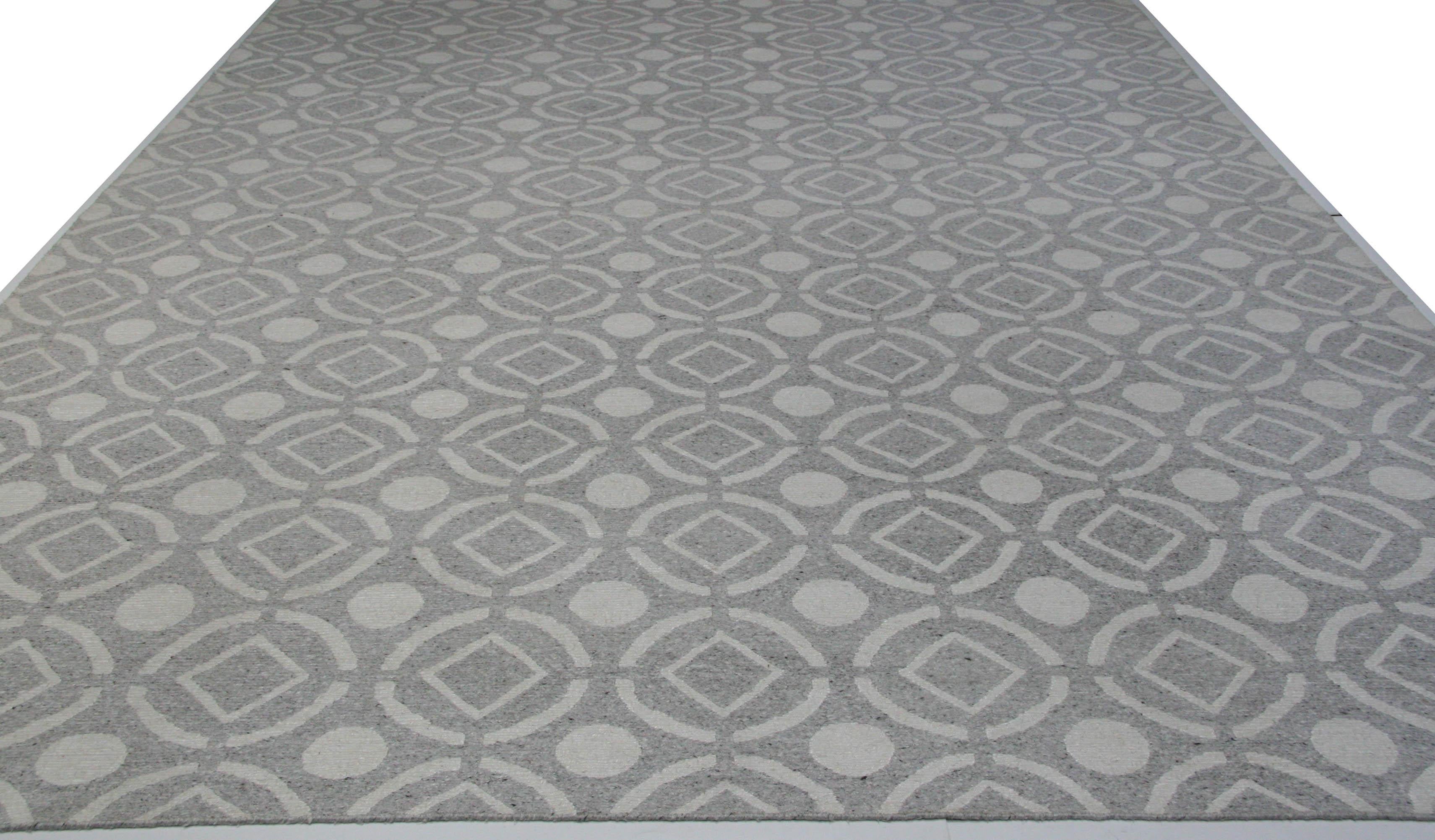 Gray and ivory combine in a pattern reminiscent of a cool tiled floor. The wool/viscose blend makes for durability and comfort underfoot. A great rug for the contemporary home or office. Hand knotted in India.