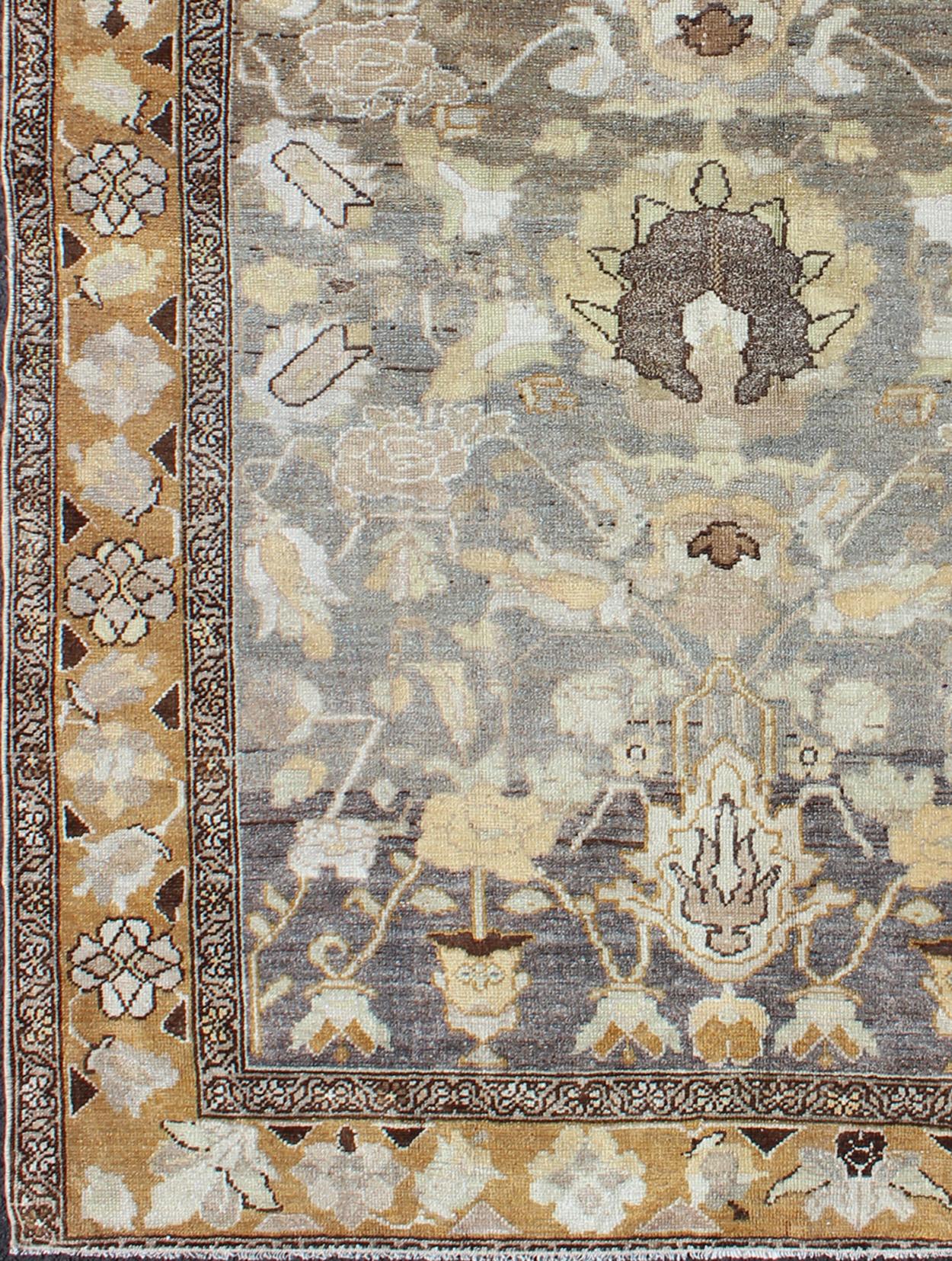 Antique Persian Bakhtiari rug, distressed antique from Persia with flowing flowers, rug ema-7554, country of origin / type: Iran / Bakhtiari, circa 1920s.

This antique distressed Persian Bakhtiari rug from early-20th century Iran features an