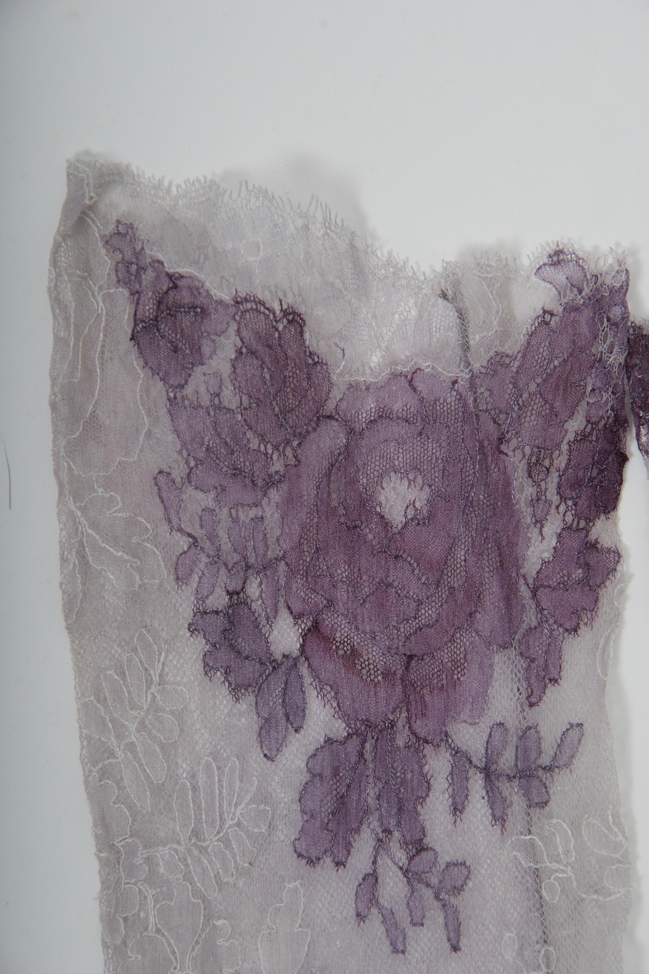 A unique and fabulous find, these vintage lace gloves in pale gray are overlayed with purple lace floral appliqués. Over-the-elbow length and finished with edge conforming to lace pattern. Fits medium hand, approximately size 7-7 1/2 and fabric has