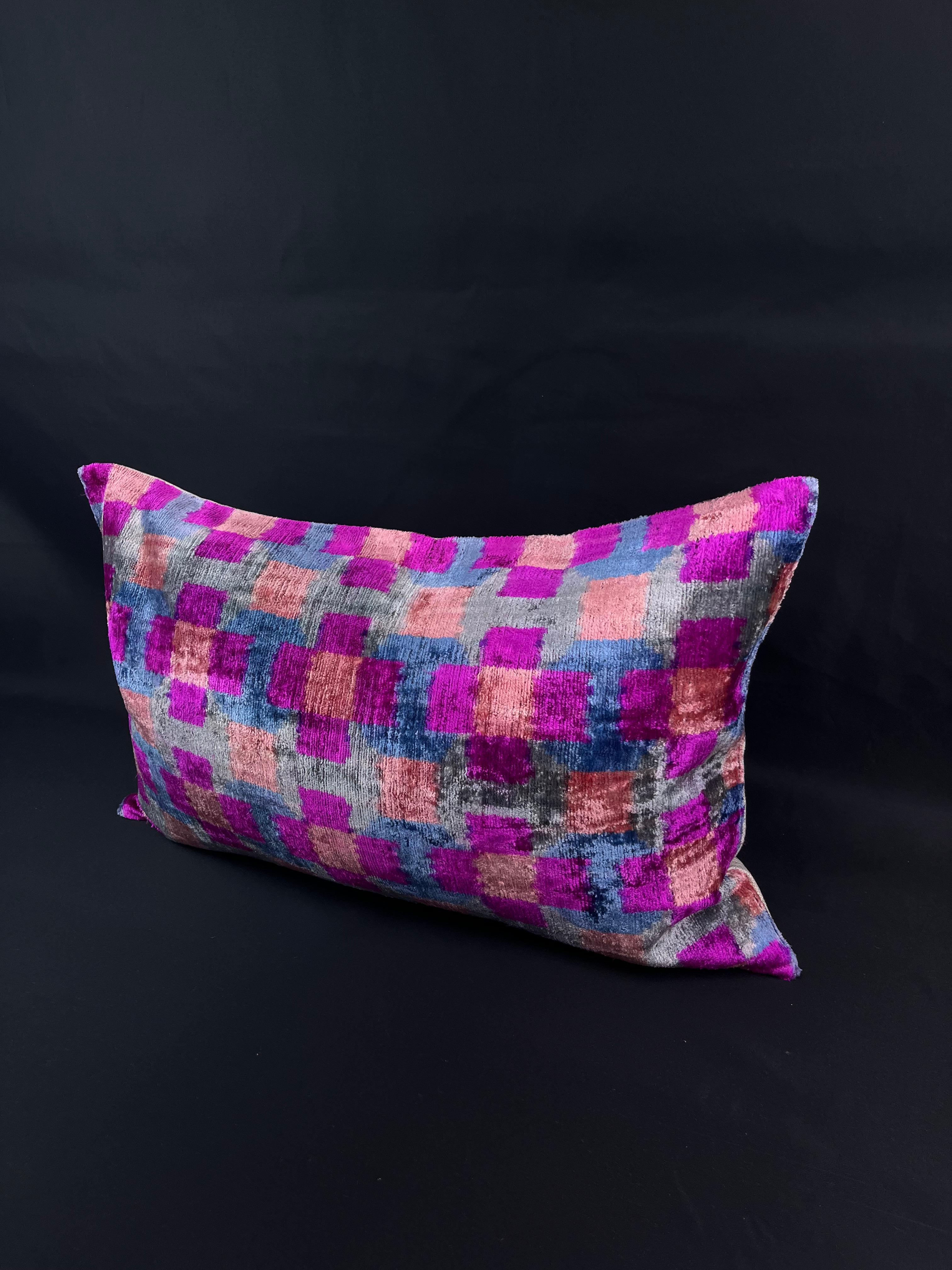 Introducing a stunning Turkish velvet ikat pillowcase, expertly handwoven from the finest silk and adorned with vibrant hand-dyed patterns. This exquisite pillowcase is a true work of art, crafted by skilled artisans using traditional techniques