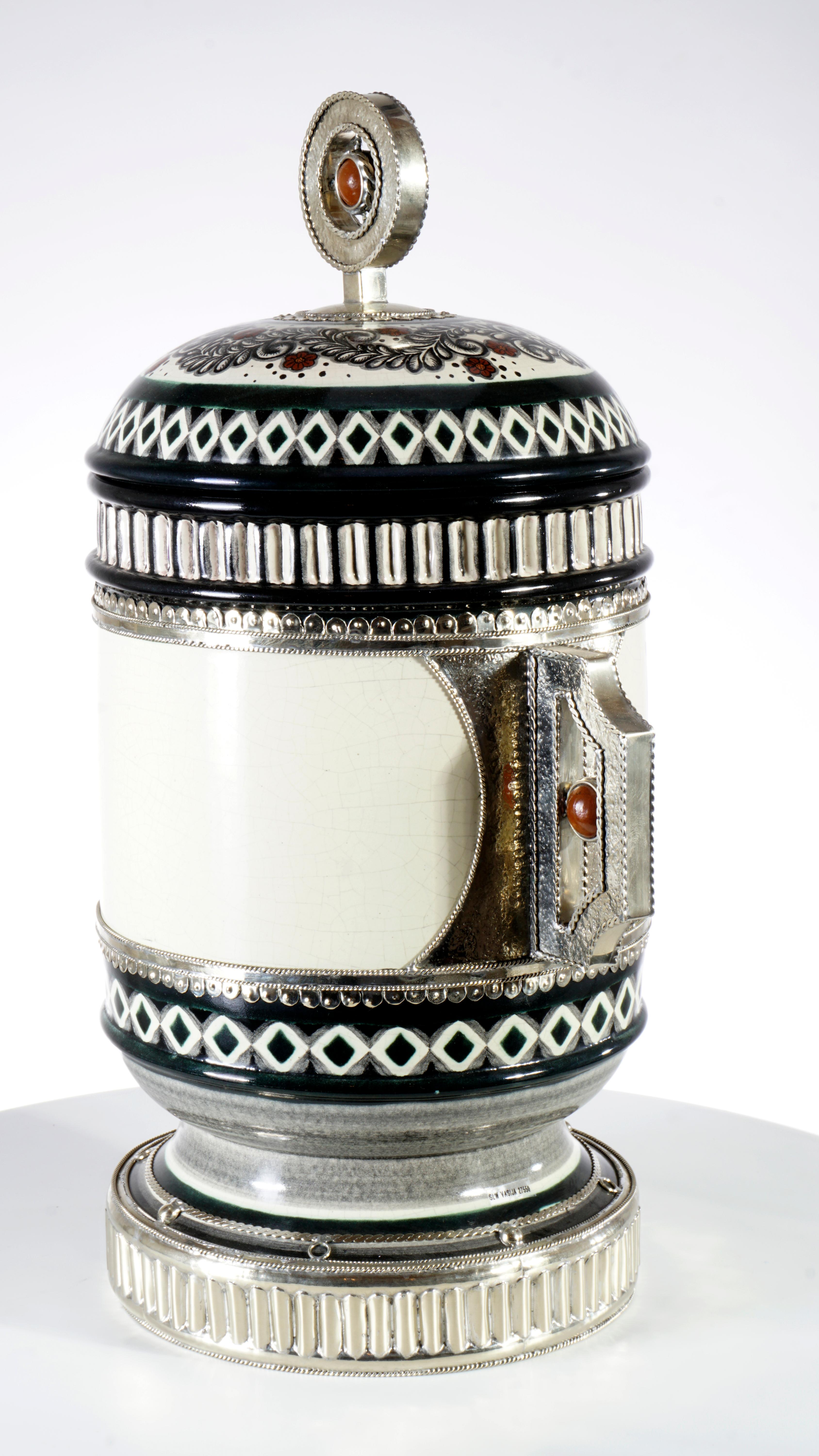 Always unique pieces is what you are going to hear about Jesus Guerrero Santo's work, all the pieces are handmade and created one by one it takes months to produce each peace.
This ceramic and White metal (alpaca) Jar, was created in Tonalá,