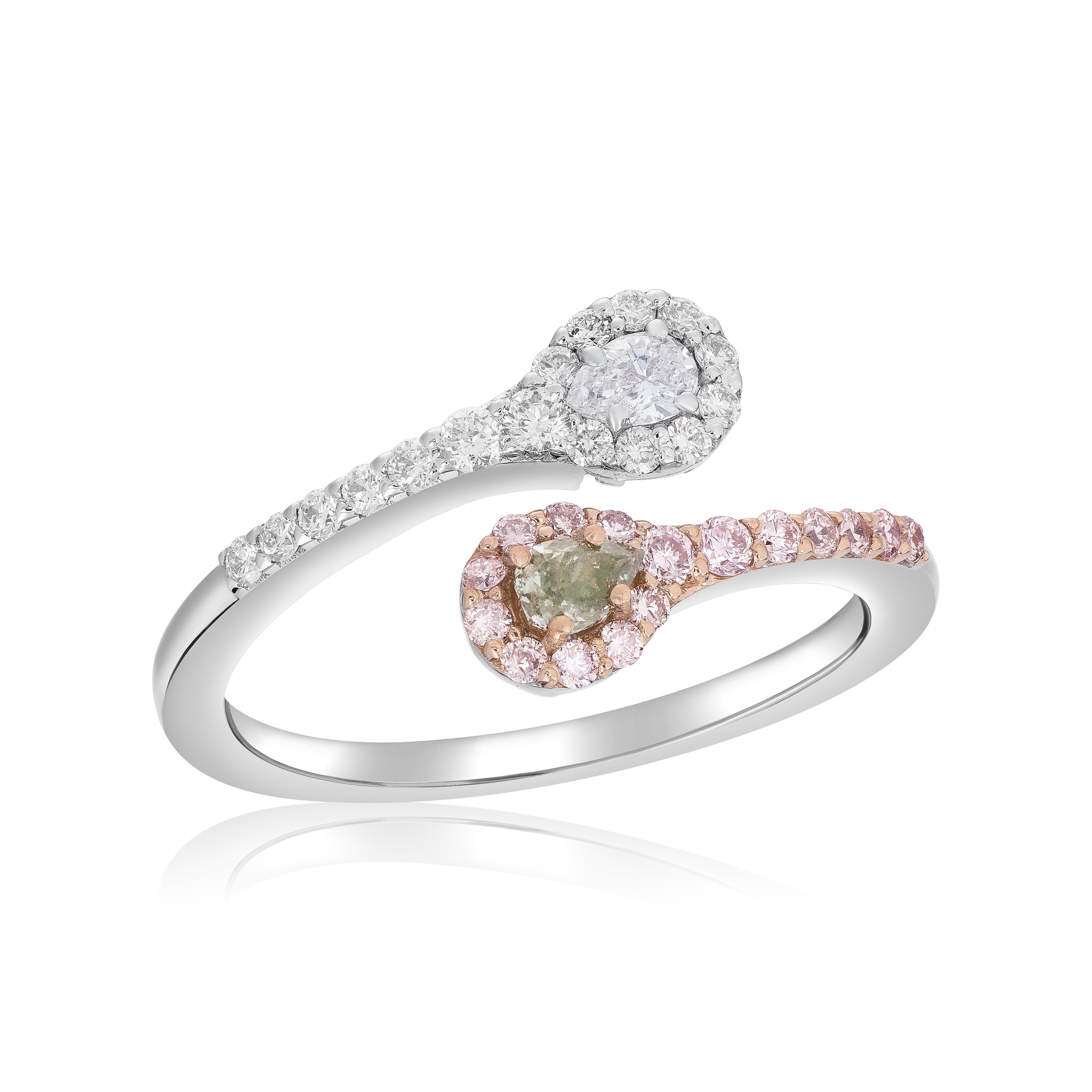 Make a statement with this exquisite fancy color diamond pear shape bypass ring. The centerpiece of this ring is a striking 0.11 carat fancy greenish gray pear-shaped diamond, capturing attention with its unique and captivating hue. Adding a touch