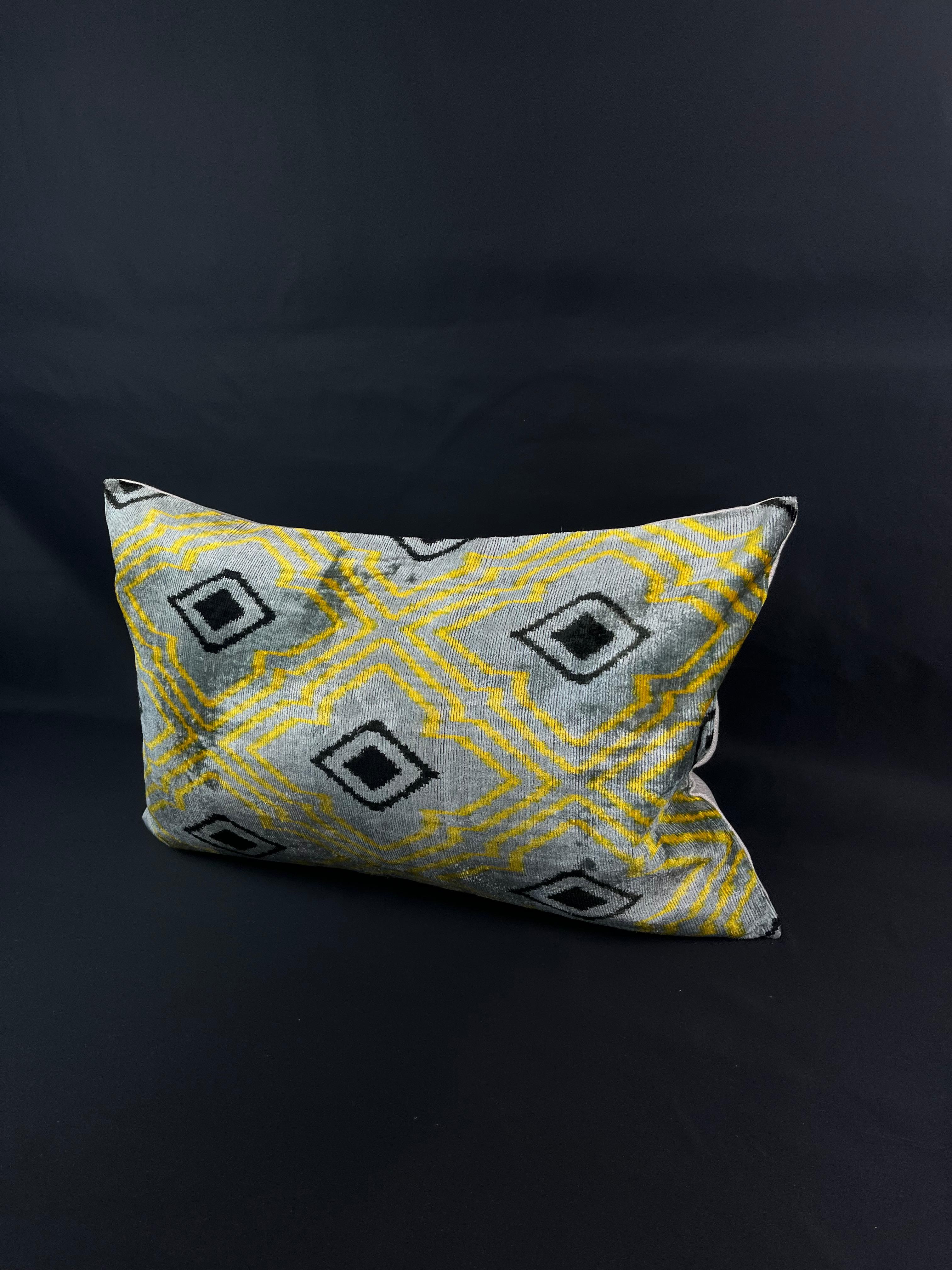 Introducing a stunning Turkish velvet ikat pillowcase, expertly handwoven from the finest silk and adorned with vibrant hand-dyed patterns. This exquisite pillowcase is a true work of art, crafted by skilled artisans using traditional techniques