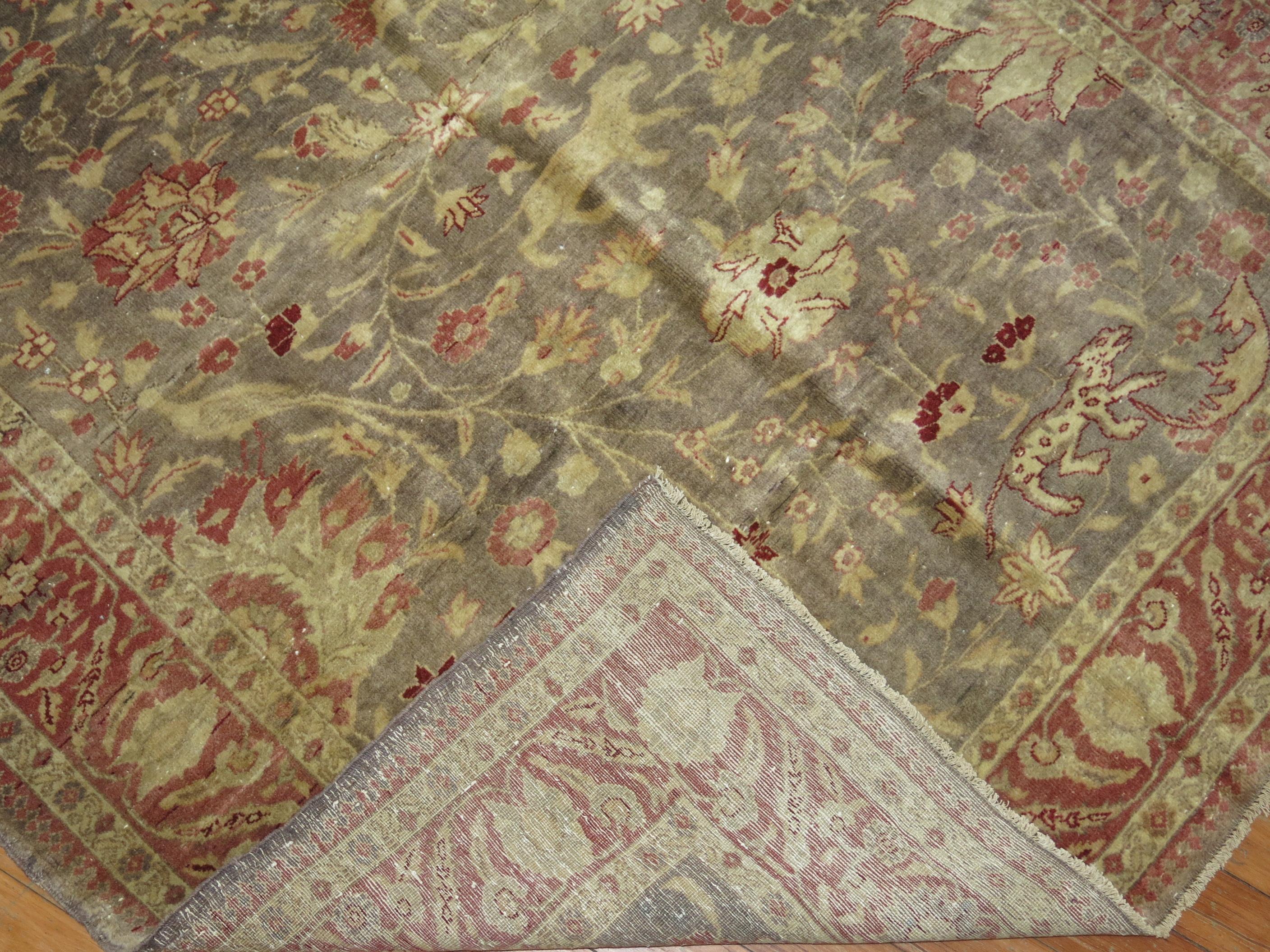Accent size pictorial Turkish Sivas carpet from the first quarter of the 20th century. The gray field with a flurry of wild and exotic animals, accents in beige and crimson red. A conversation piece that would be fitting in foyer. Light enough to