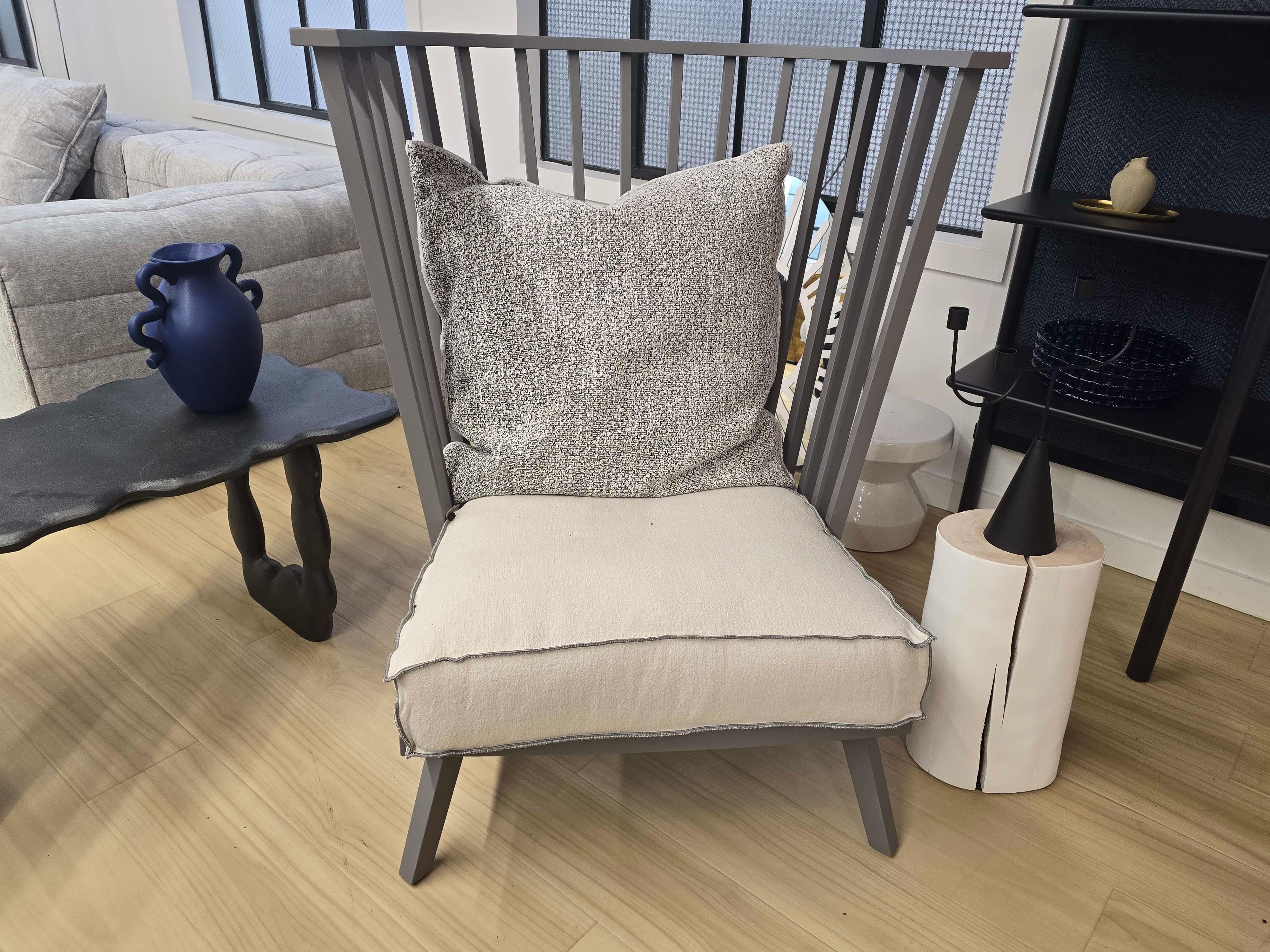Gray Bergere armchair by Paola Navone

The GRAY 06 bergère has a curved design that evokes the classic Nordic style. It features a very high and prominent backrest with an enveloping design and wooden slats that create an interplay of solids and