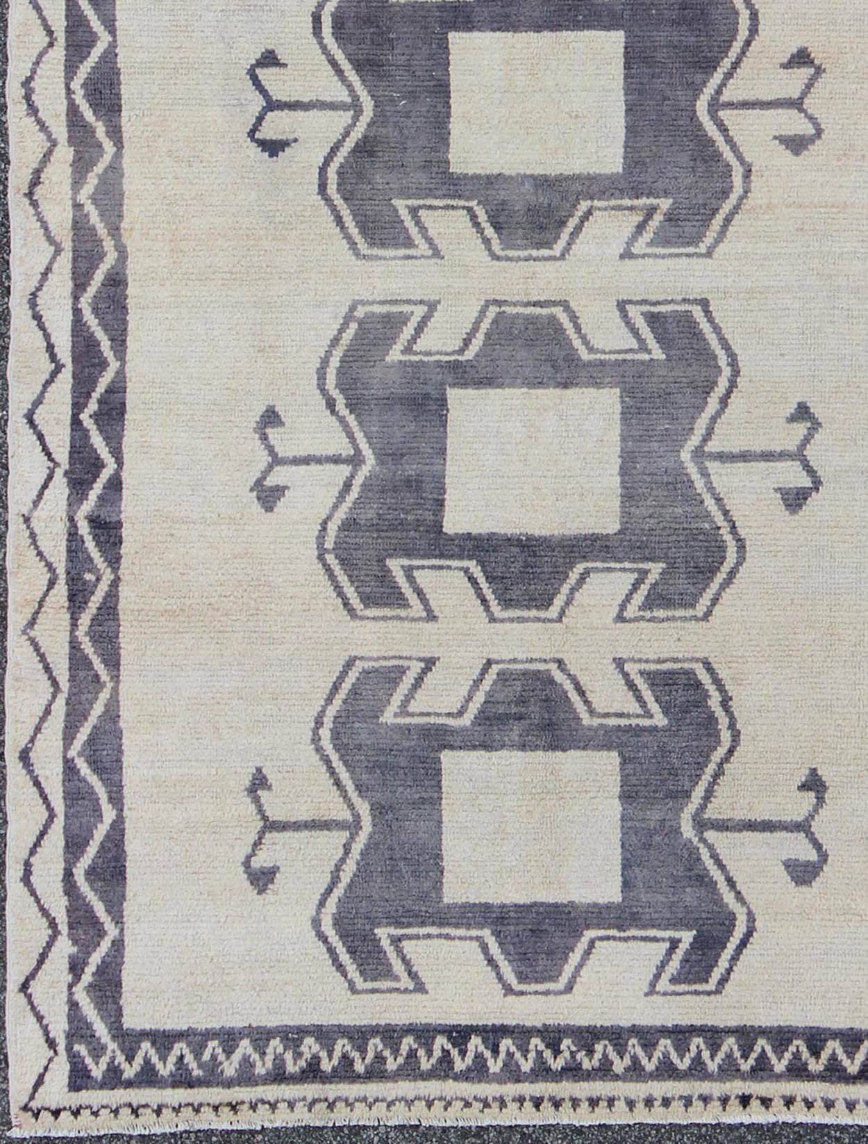 Measures: 4'11 x 9'8

Turkish Tulu rug with tribal medallion design and cream in deep Purple/Gray and ivory. Tribal design Tulu rug with tribal design. 
Keivan Woven Arts/ Rug/EN-141883, country of origin / type: Turkey / Tulu, circa 1950.

This