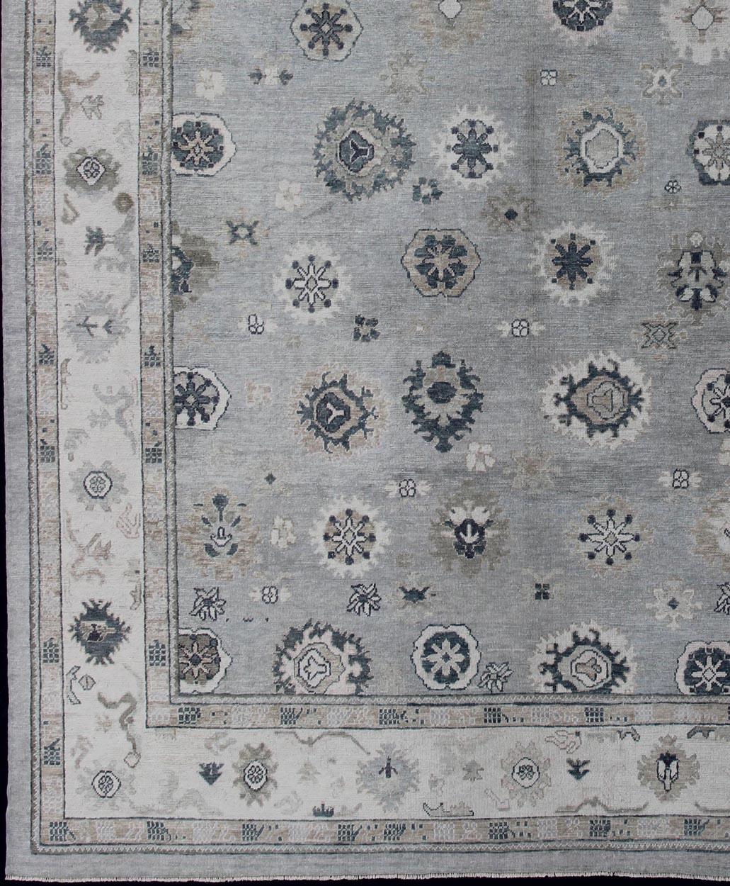 Turkish Oushak rug with neutral color palette and all-over flower design, rug en-179692, country of origin / type: Turkey / Oushak

This traditional Oushak rug from Turkey features a subdued, neutral color palette and an all-over design of floral
