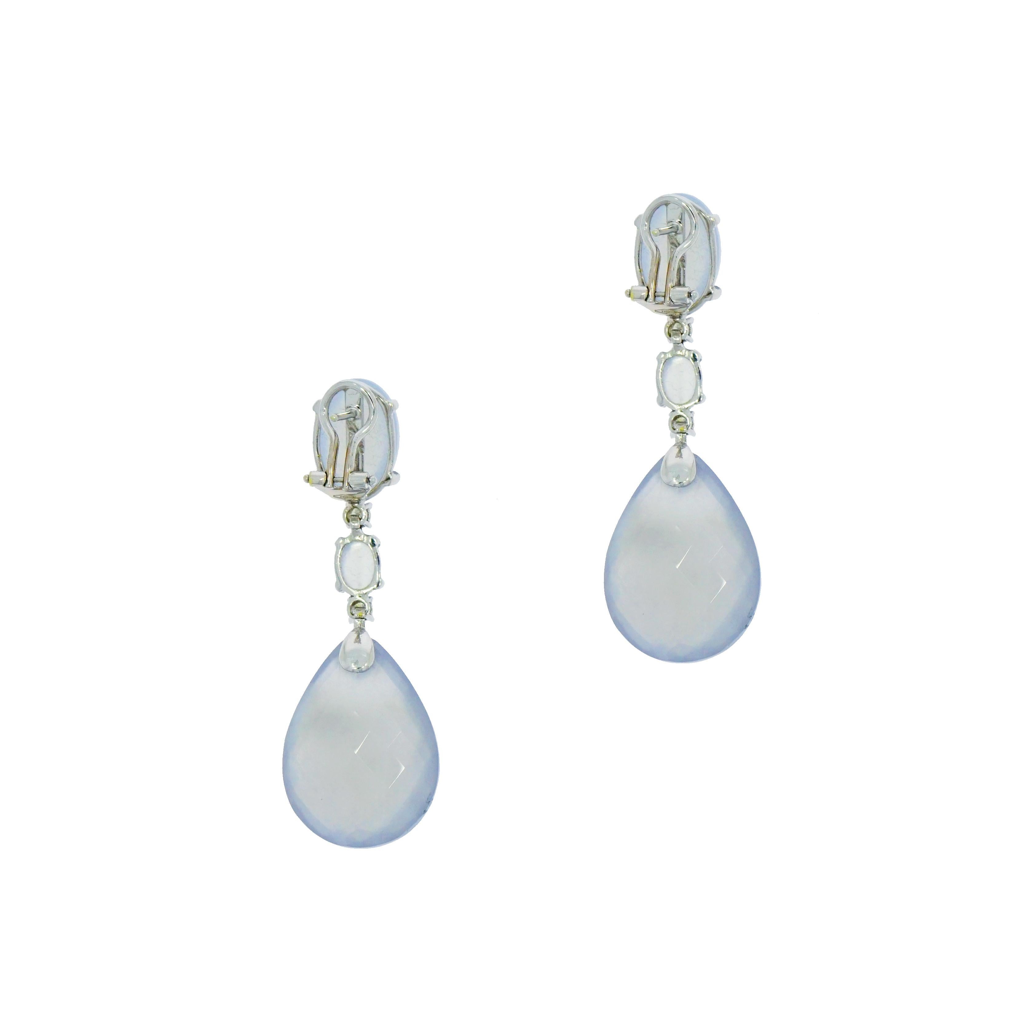 This pair of light blue grayish chalcedony drop earrings featuring a fun and unique stone, shape, and design. You won't find anything else like them! 
Faceted Pear Shaped Chalcedony accented with an oval shaped chalcedony and 0.40 carat total weight