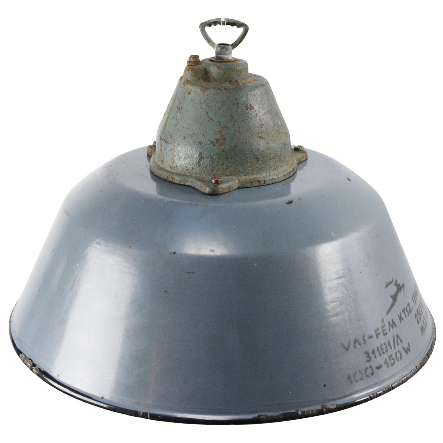Factory pendant. Blue gray enamel white interior. Cast iron top with clear glass.

Measures: Weight 3.4 kg / 7.5 lb

Priced per individual item. All lamps have been made suitable by international standards for incandescent light bulbs,